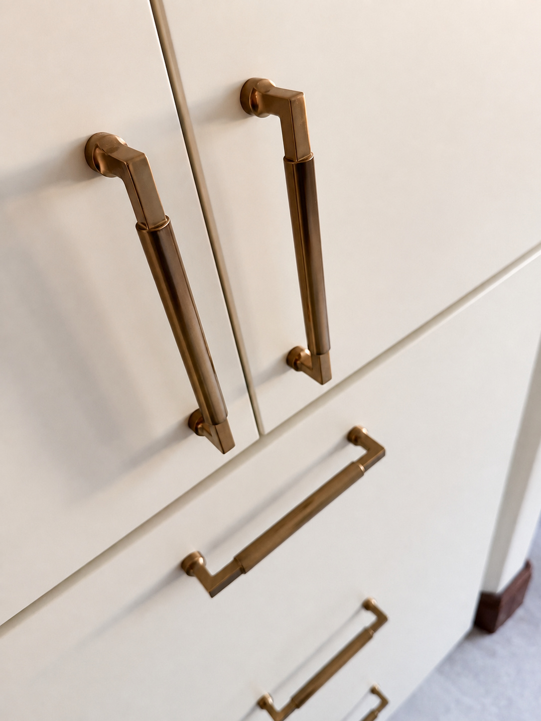 brass cabinet pulls on white built in bathroom storage in littleton co kitchen and bathroom remodel