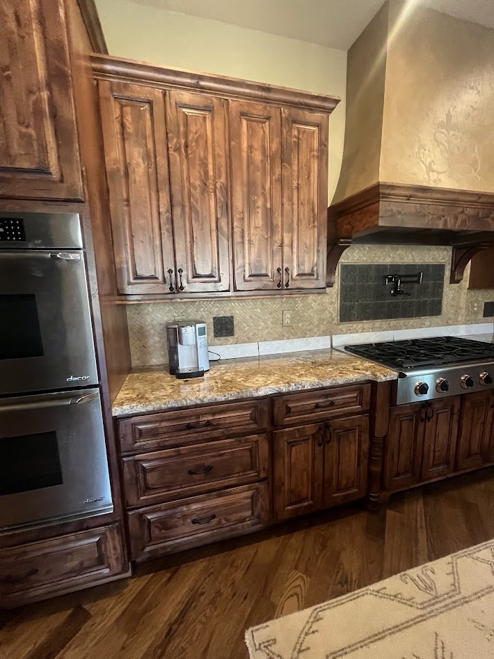 littleton co kitchen and bathroom remodel before kitchen wall with double ovens wood cabinets granite counter and gas range