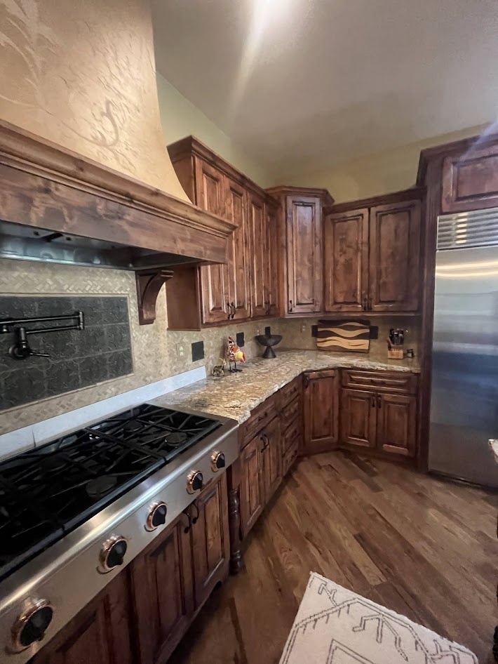 littleton co kitchen and bathroom remodel before view with rustic wood cabinets granite counters and gas range