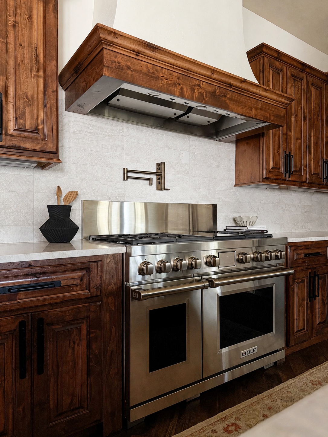 stainless steel range with wood hood and pot filler in littleton co kitchen remodel