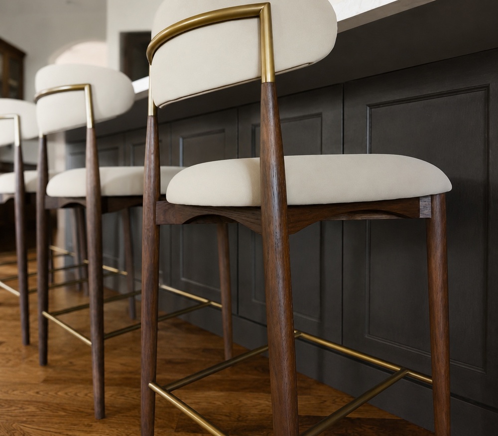 upholstered wood and brass bar stools at dark kitchen island in littleton co kitchen remodel