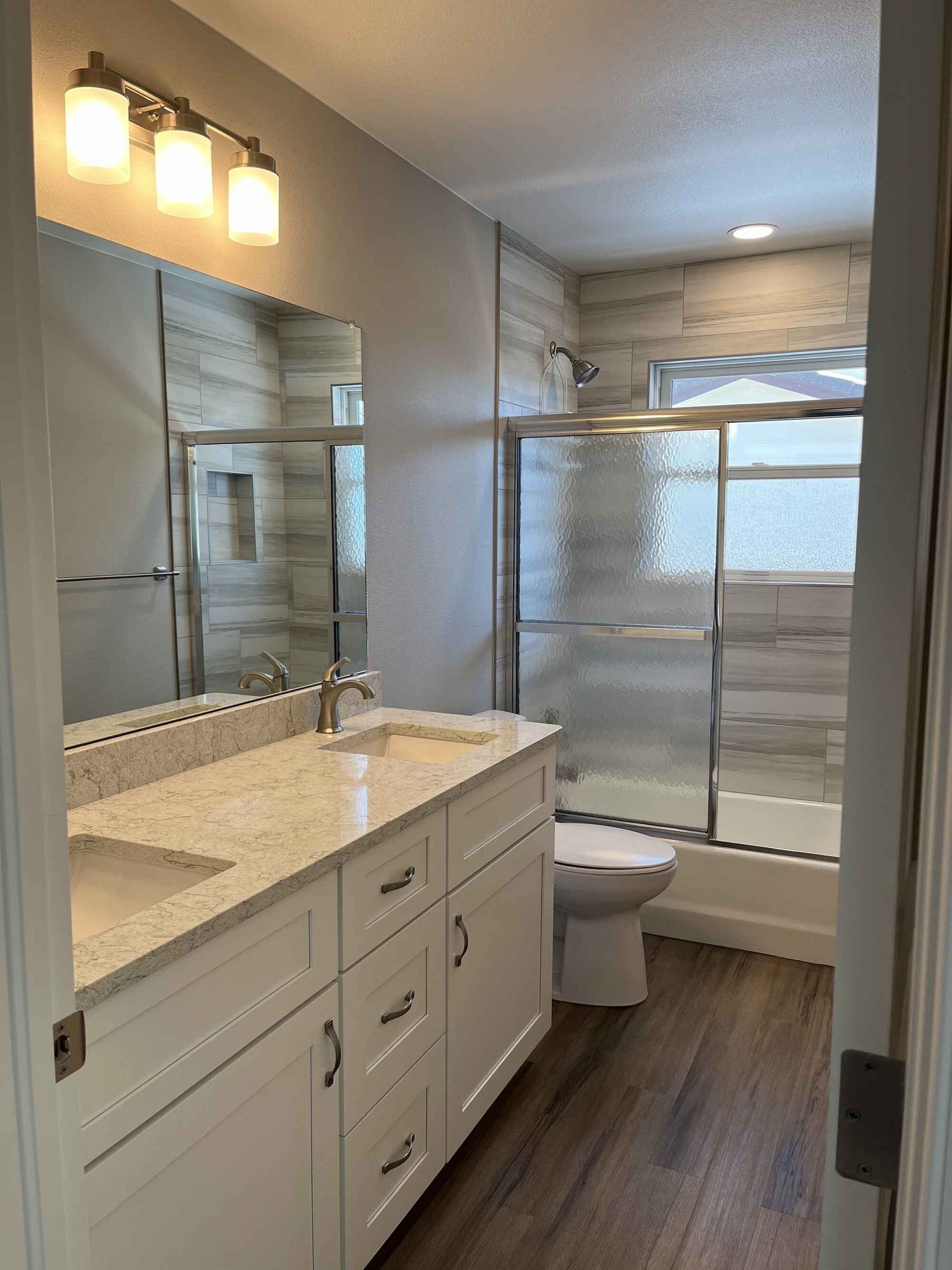 Custom-bright-bathroom-white-cabinets-gray-tile-Littleton-Colorado1