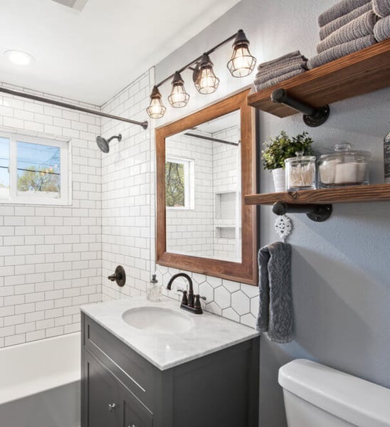 Natural-light-bathroom-paleblue-wall-wood-shelfs-Littleton-Colorado (1)