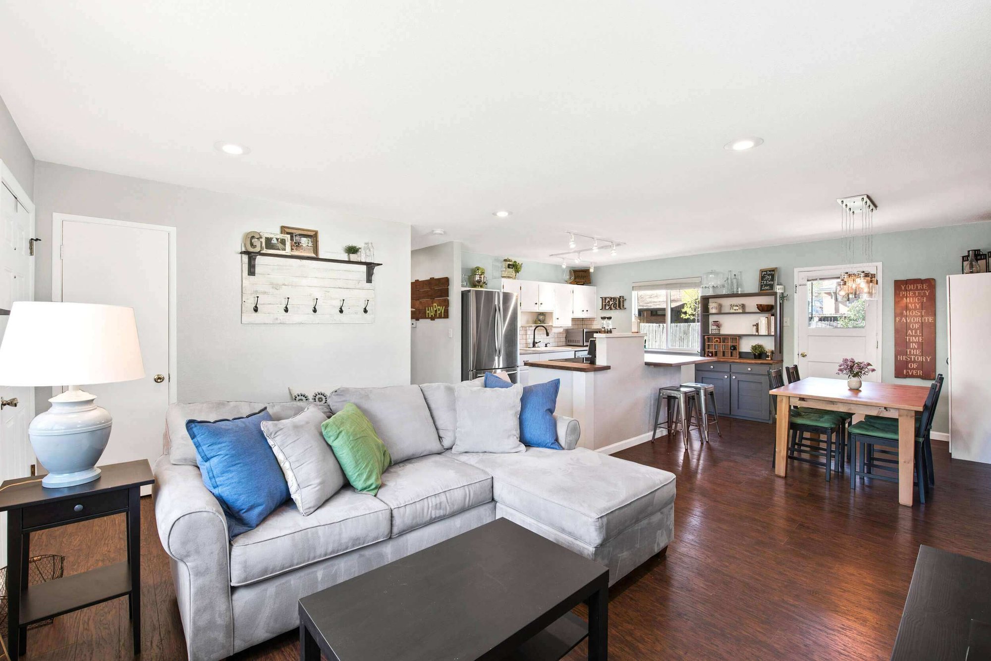 Living-room-hardwood-floor-grey-couch-white-wall-Littleton-Colorado