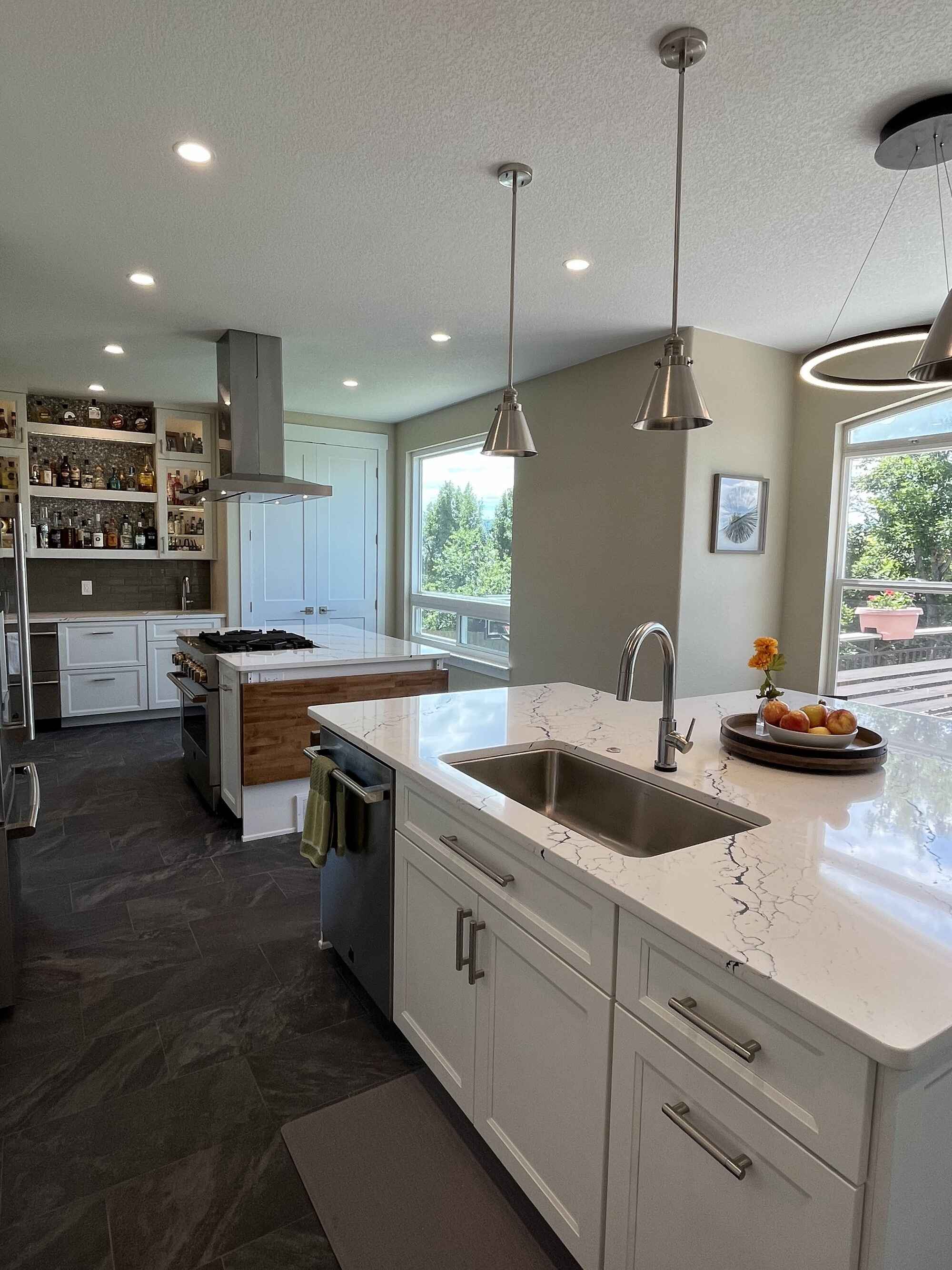 Beautiful-bright-kitchen-white-shaker-cabinets-double-island-Littleton-Colorado