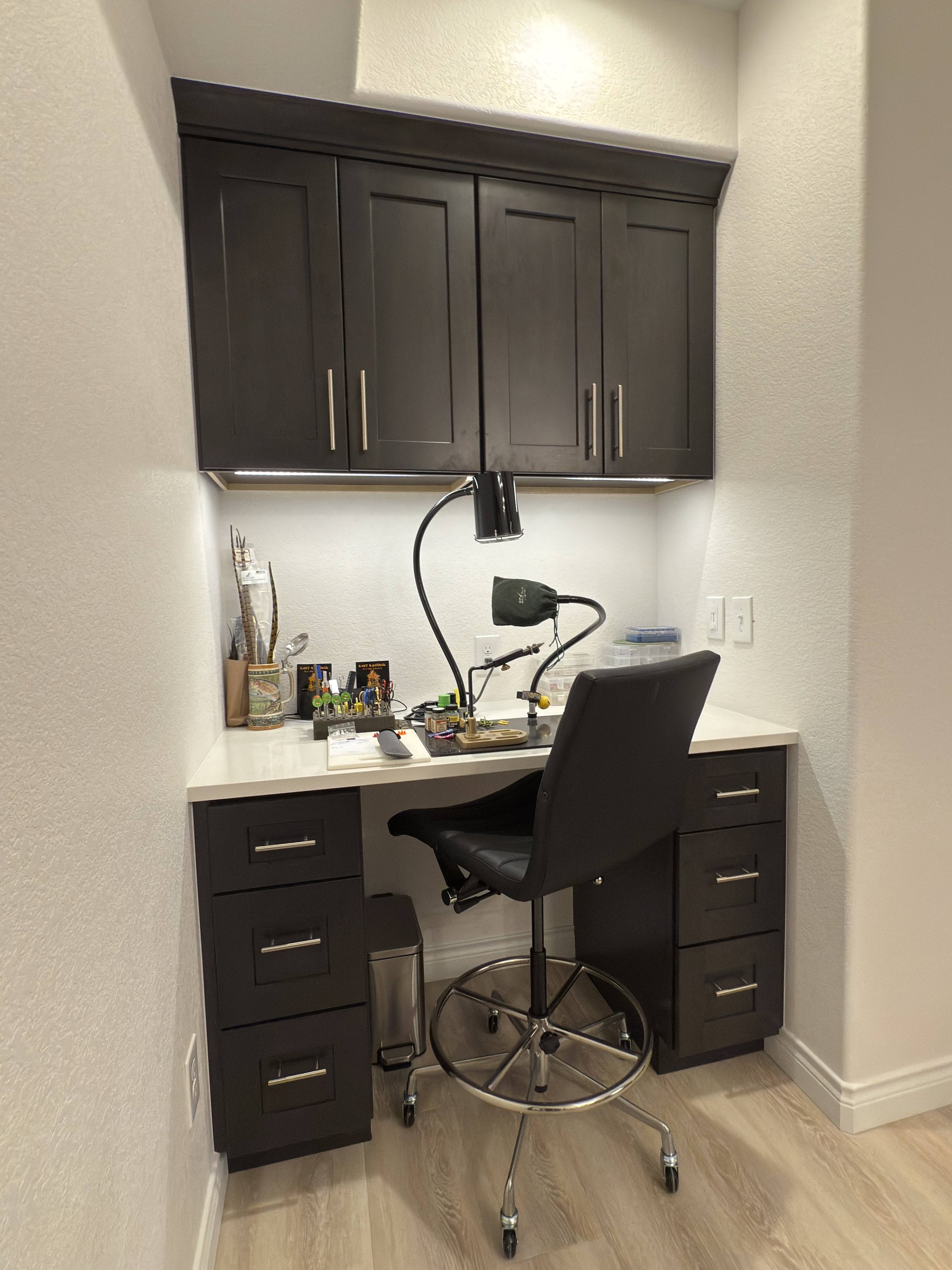 after basement remodel built in storage wall with floating wood shelves in littleton