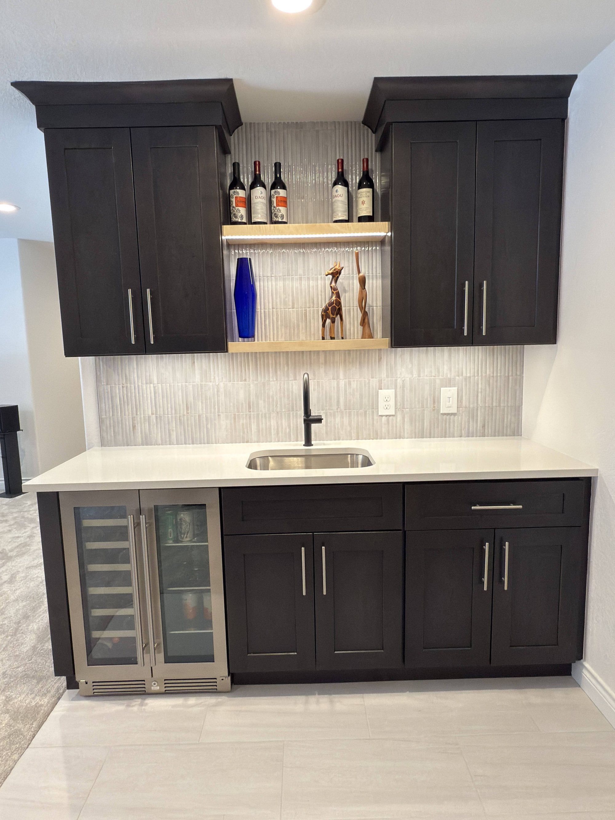 after basement remodel custom office nook with built in desk and storage in littleton