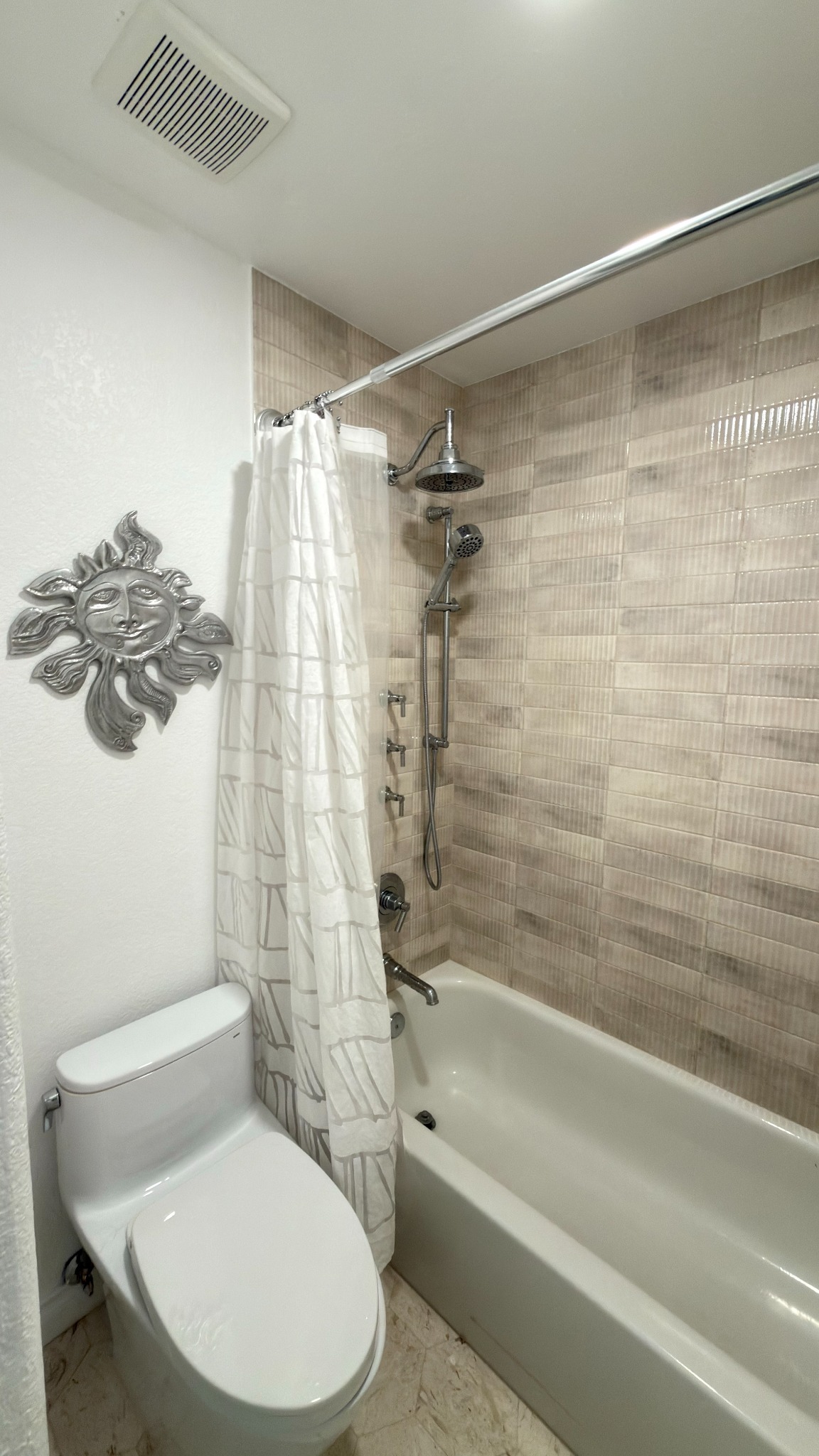 after-bathroom-remodel-with-beige-tiled-shower-and-bathtub-in-castle-pines