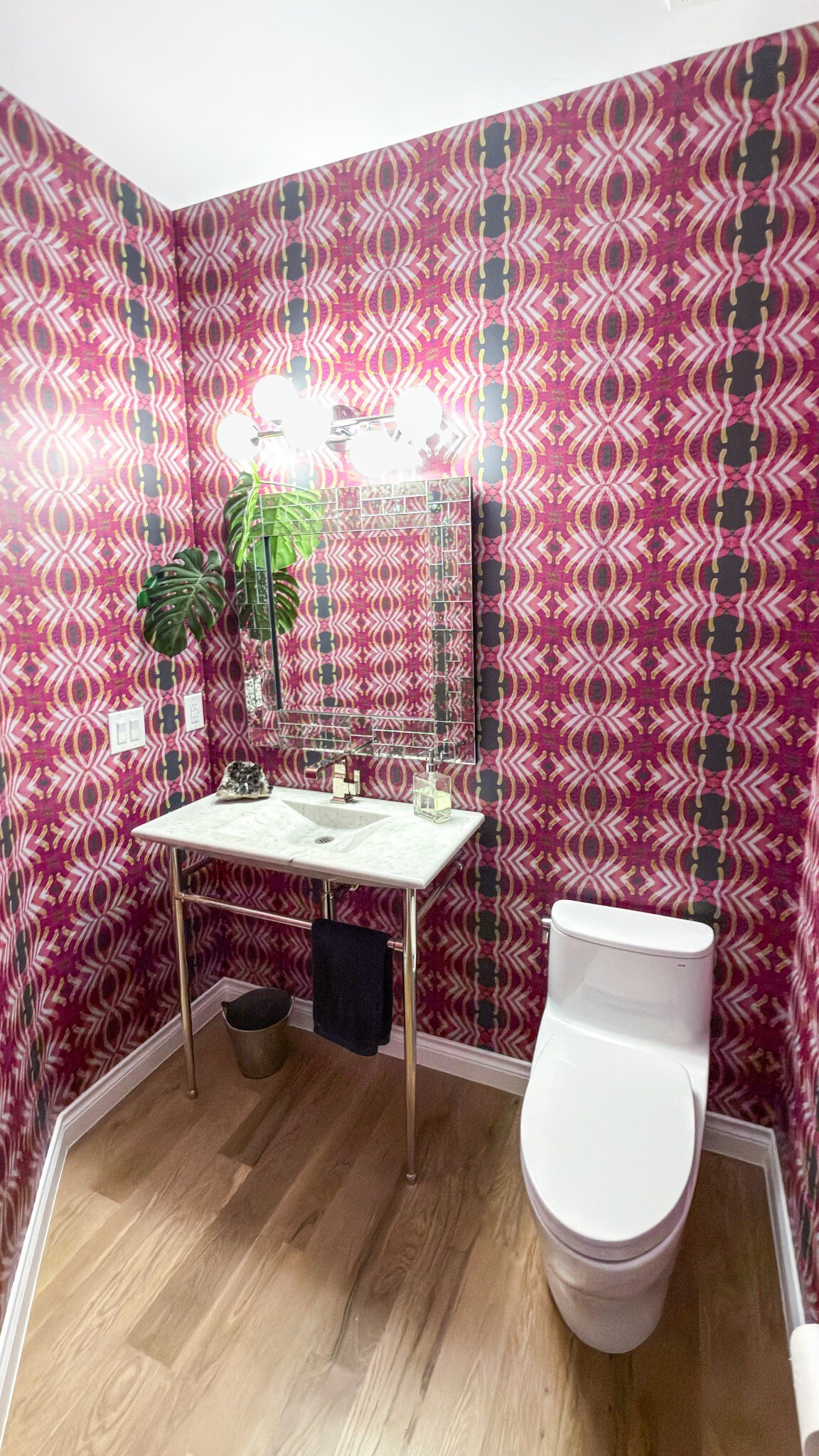 after-castle-pines-bathroom-remodel-pink-wallpaper-vanity