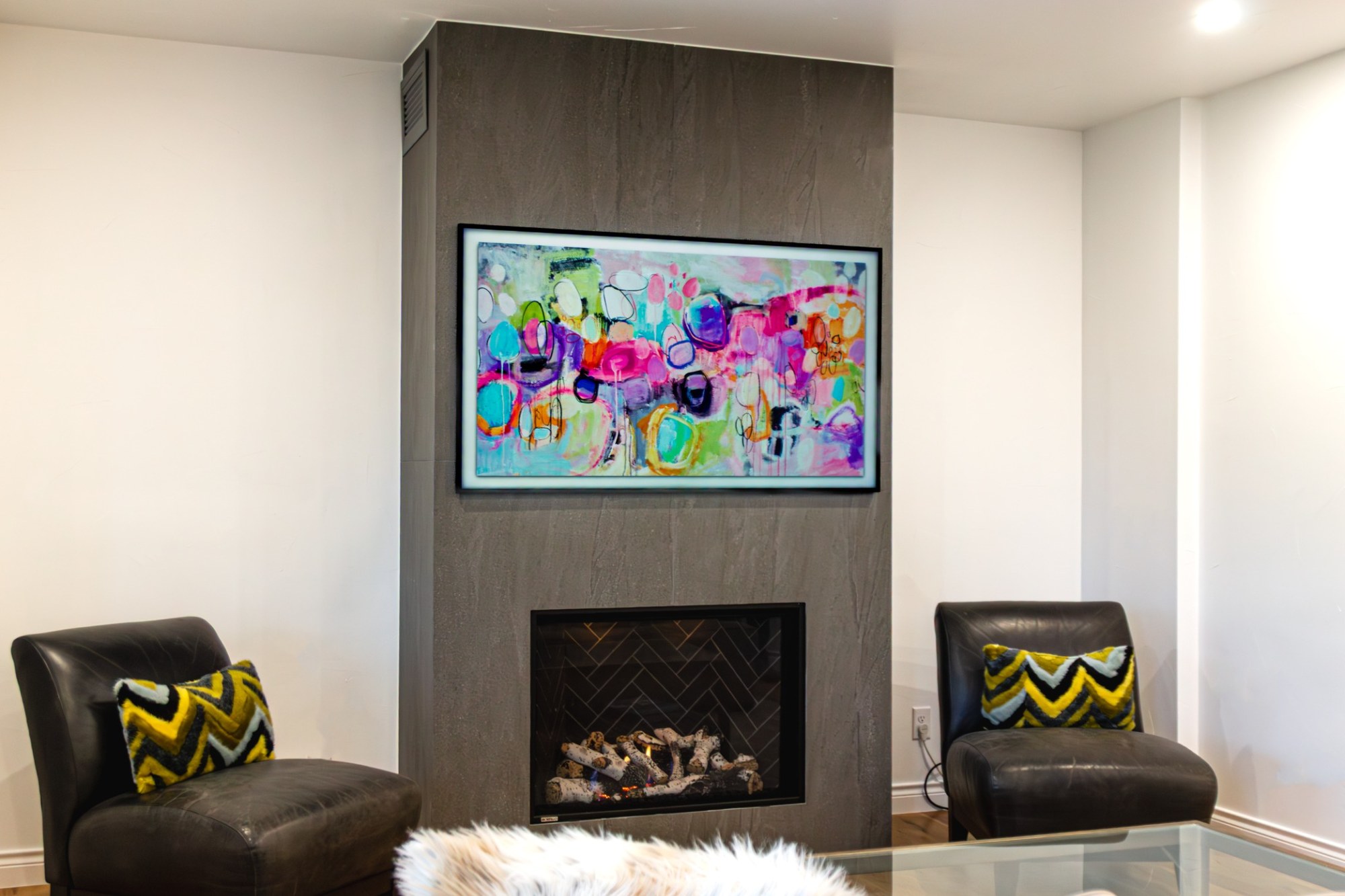 after-living-room-remodel-with-modern-fireplace-and-colorful-wall-art-in-castle-pines