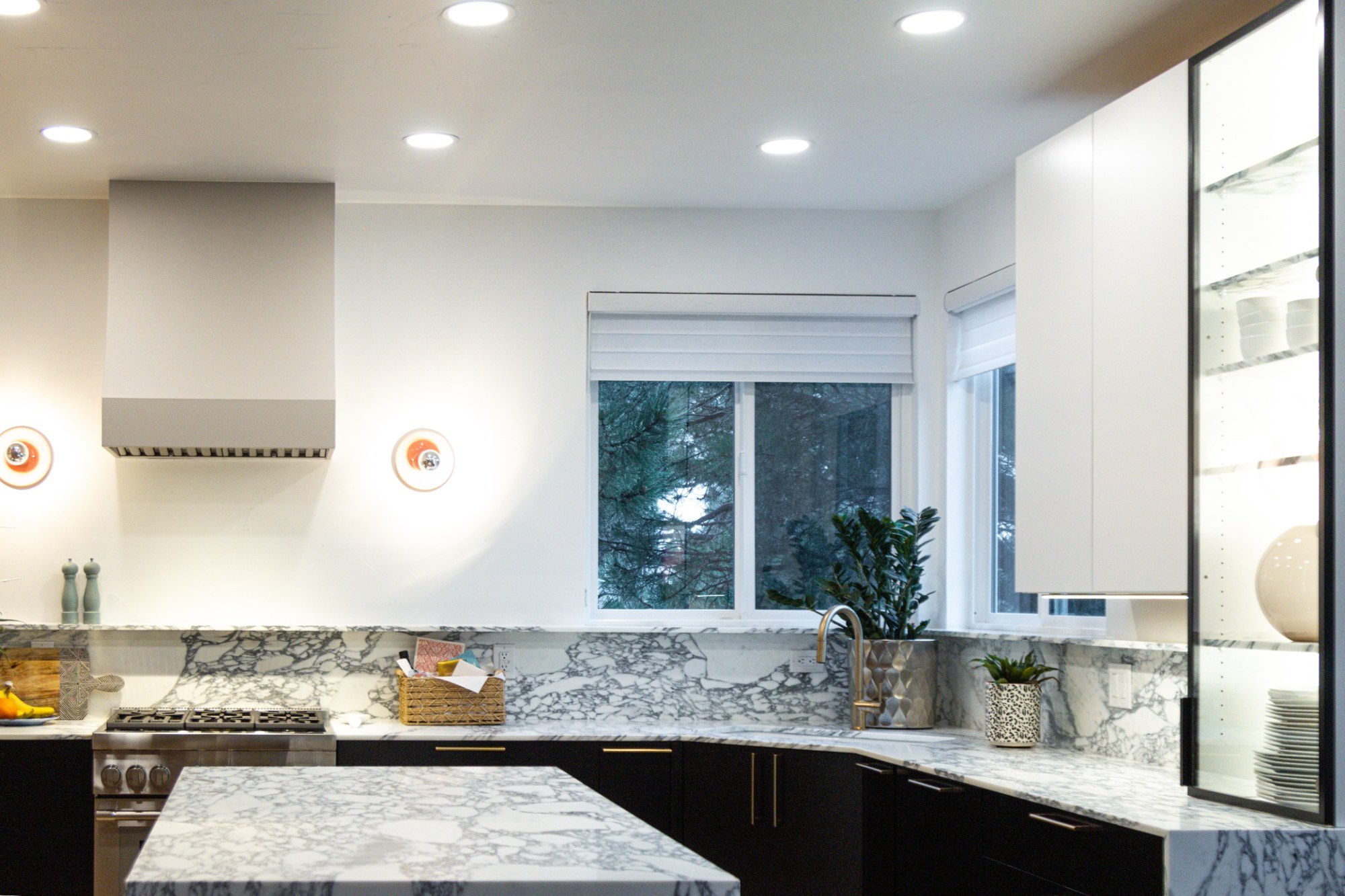 after-luxury-kitchen-remodel-with-marble-island-and-black-cabinetry-in-castle-pines