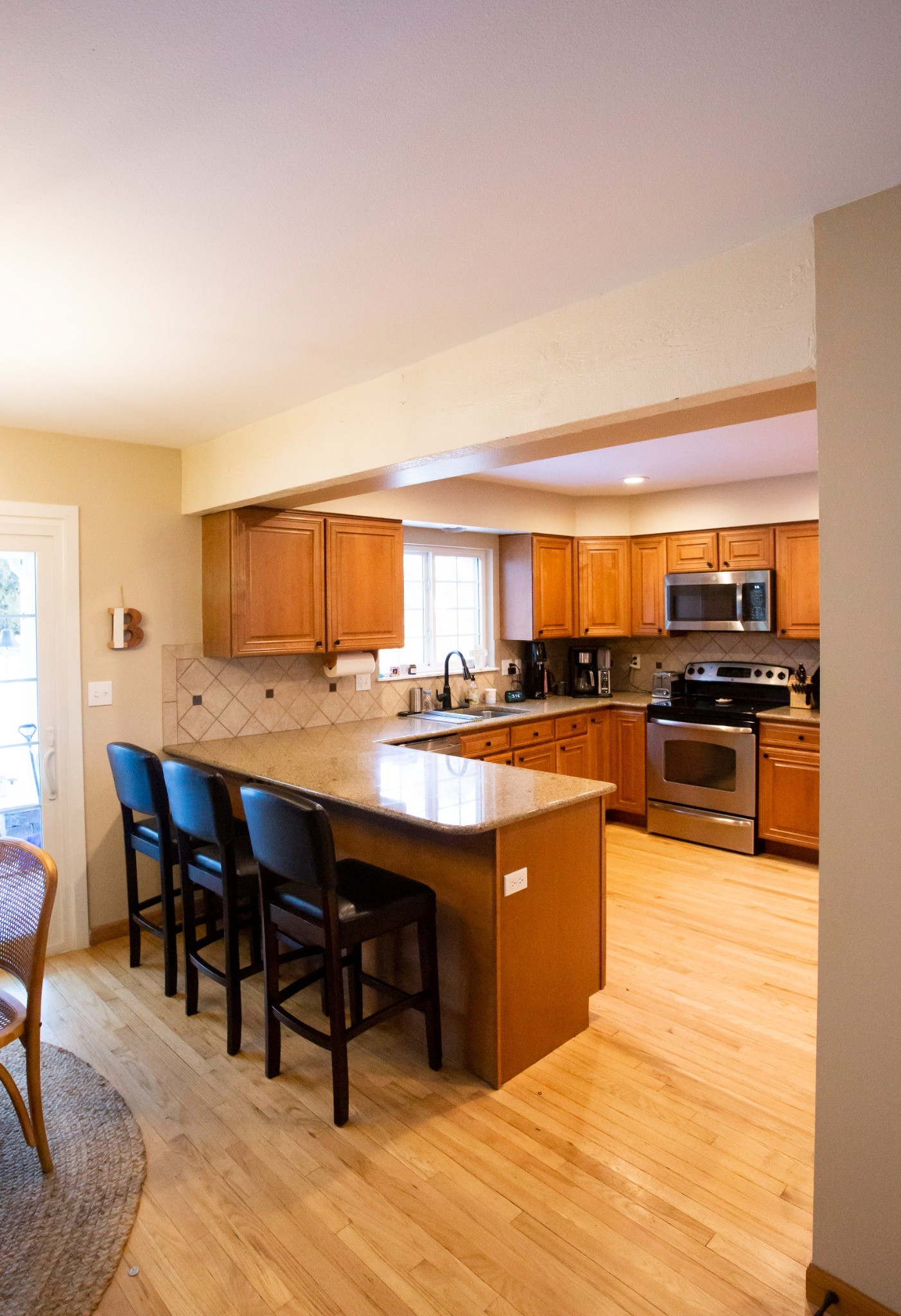 before-littleton-kitchen-remodel-peninsula-seating-and-low-beam
