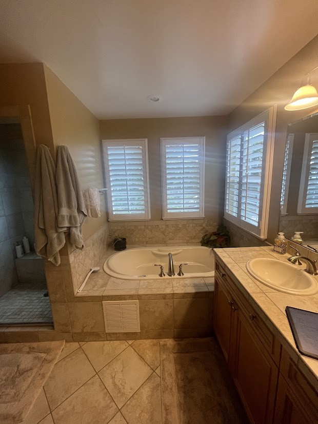 before denver bathroom remodel beige tile shower and bathtub