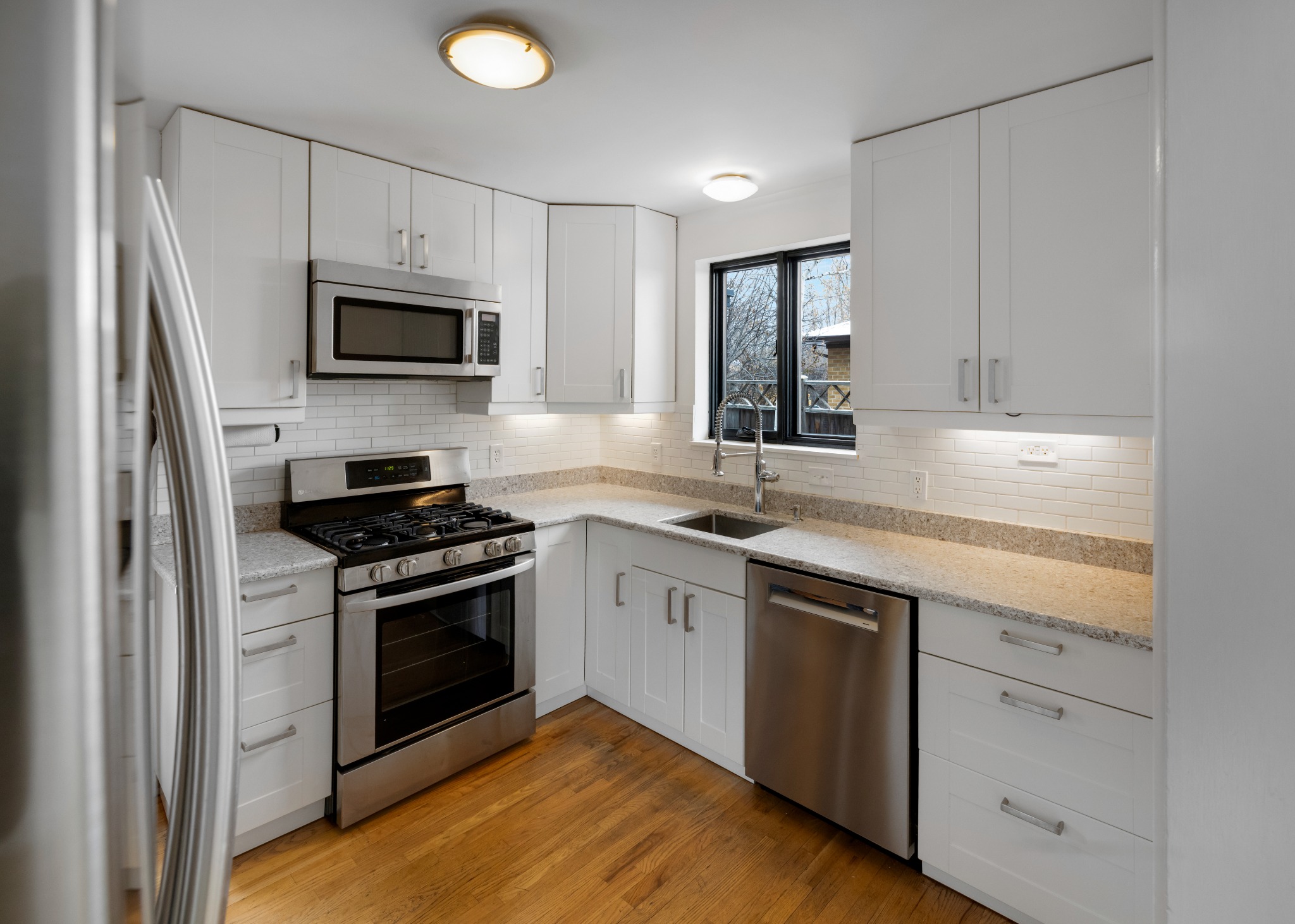 before-denver-kitchen-remodel-white-cabinets-and-hardwood-floors