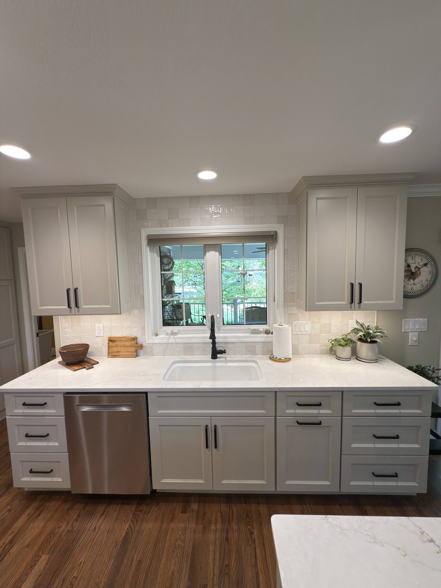 after-littleton-kitchen-remodel-sink-wall-with-dishwasher-and-white-cabinets