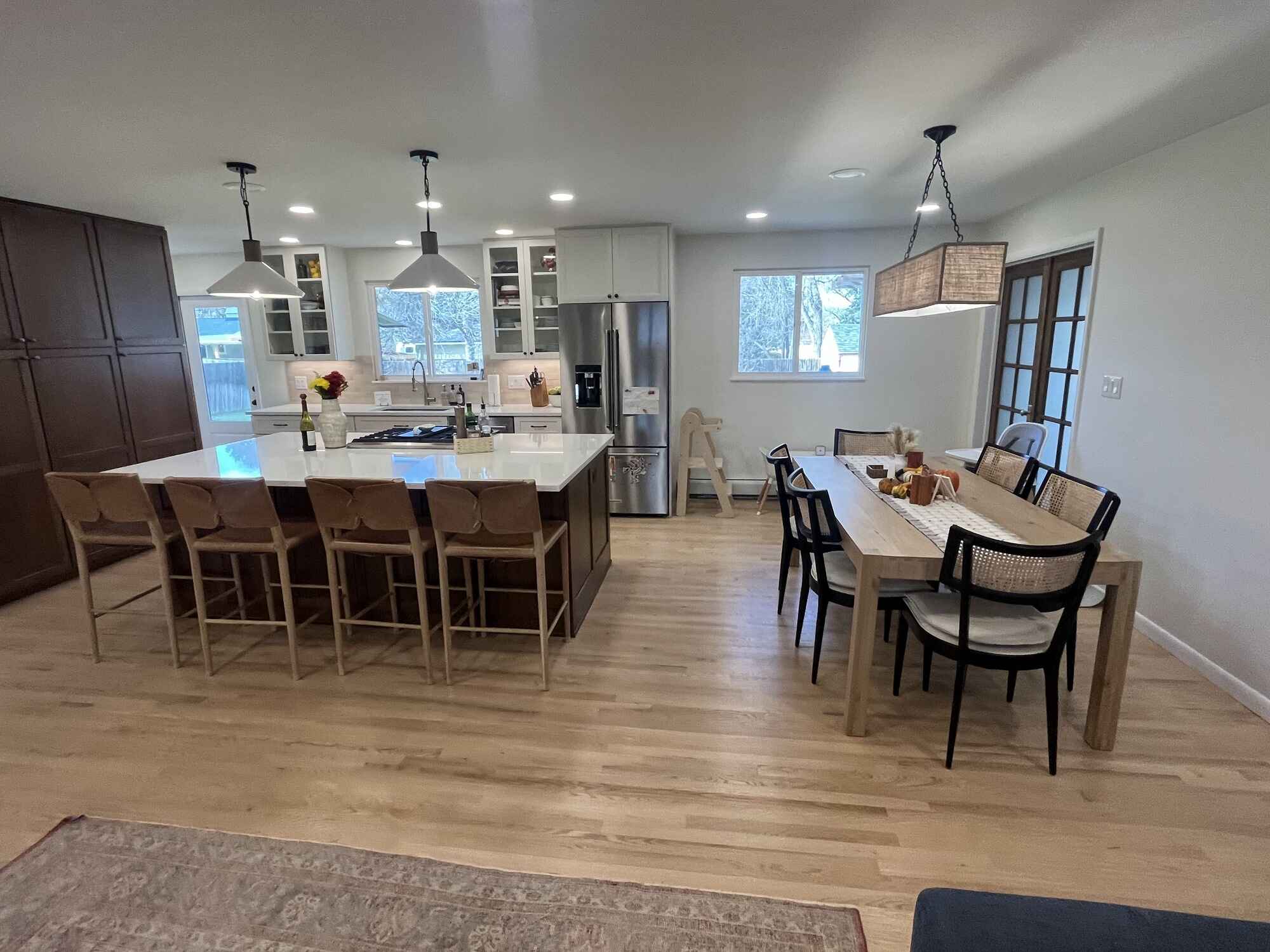 Bright-open-kitchen-large-island-wood-shaker-cabinets-quartz-countertops-Littleton-Colorado15