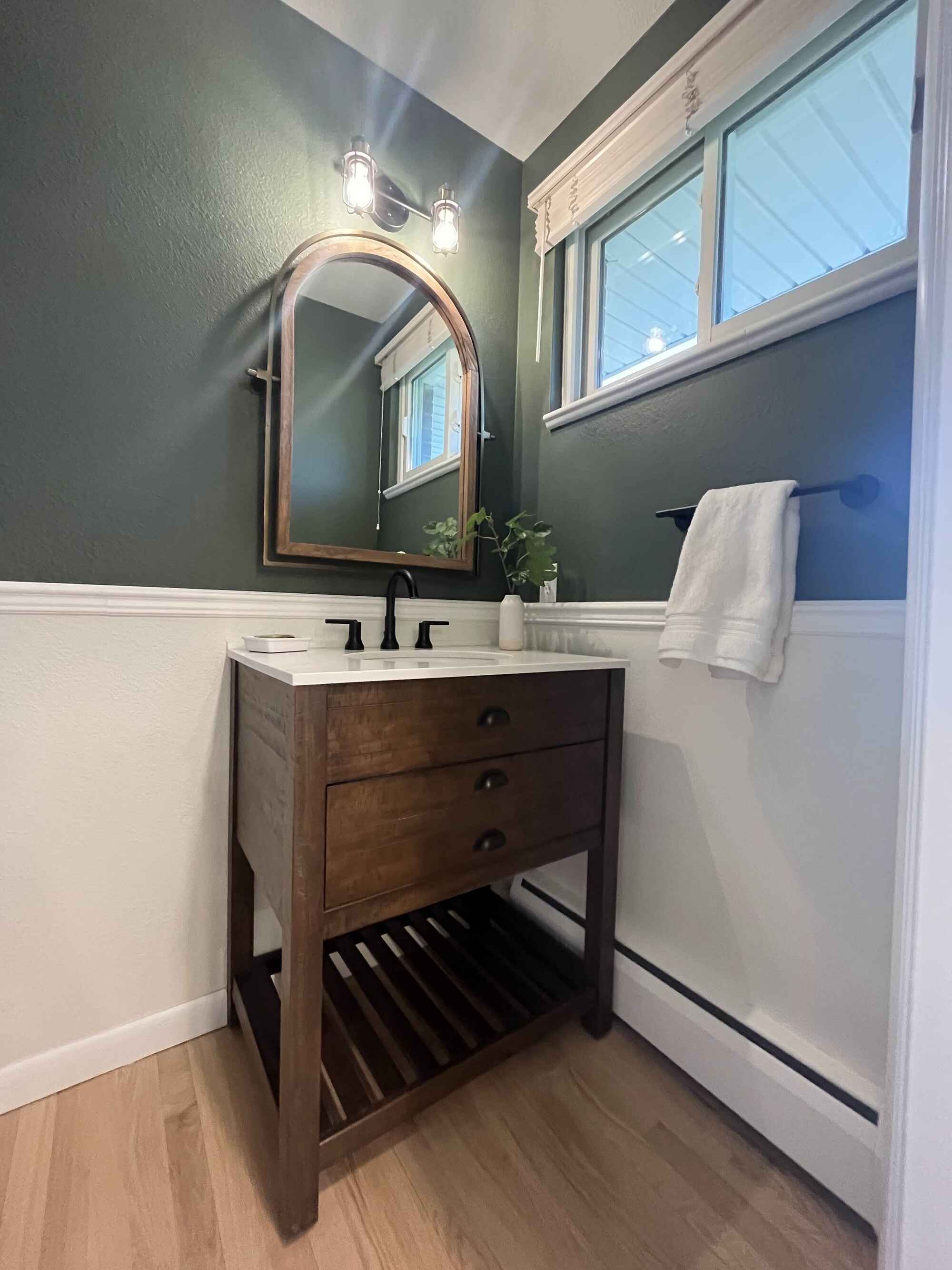 Cozy-powder-bathroom-army-green-wood-vanity-hardwood-floors-Littleton-Colorado1