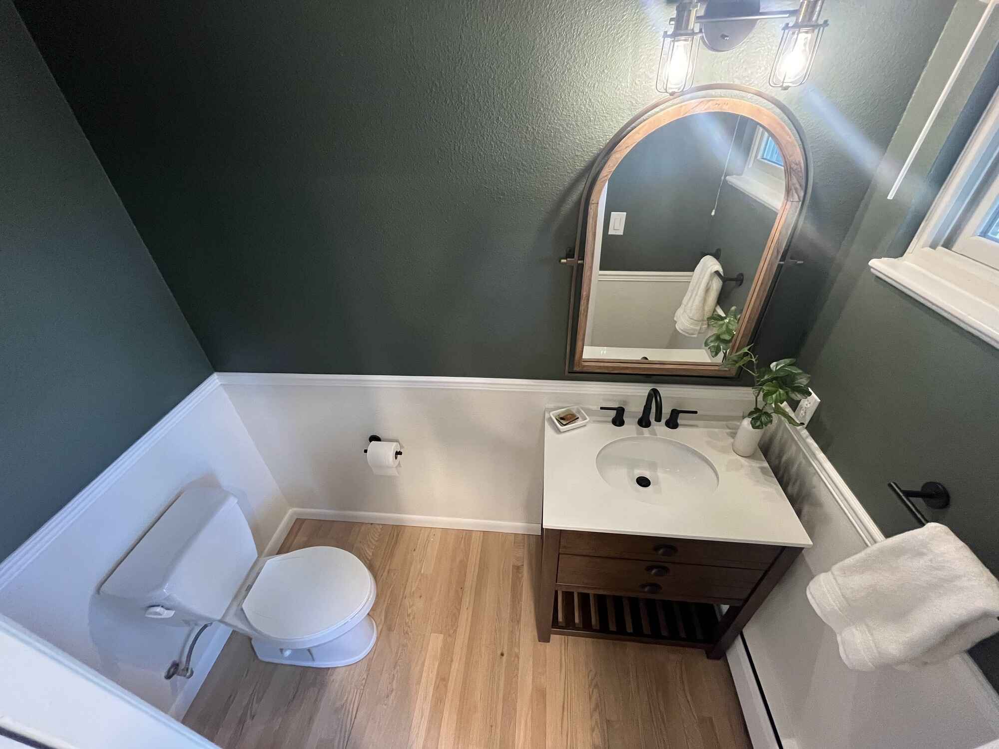 Cozy-powder-bathroom-army-green-wood-vanity-hardwood-floors-Littleton-Colorado4