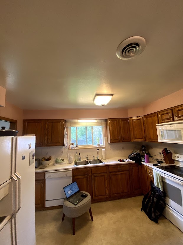 before-littleton-whole-home-remodel-original-kitchen-with-oak-cabinets-and-laminate-flooring