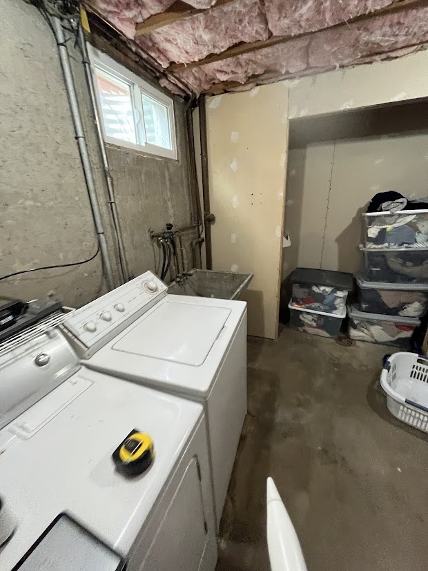 before-littleton-whole-home-remodel-unfinished-basement-laundry-room-with-exposed-insulation-and-utility-hookups