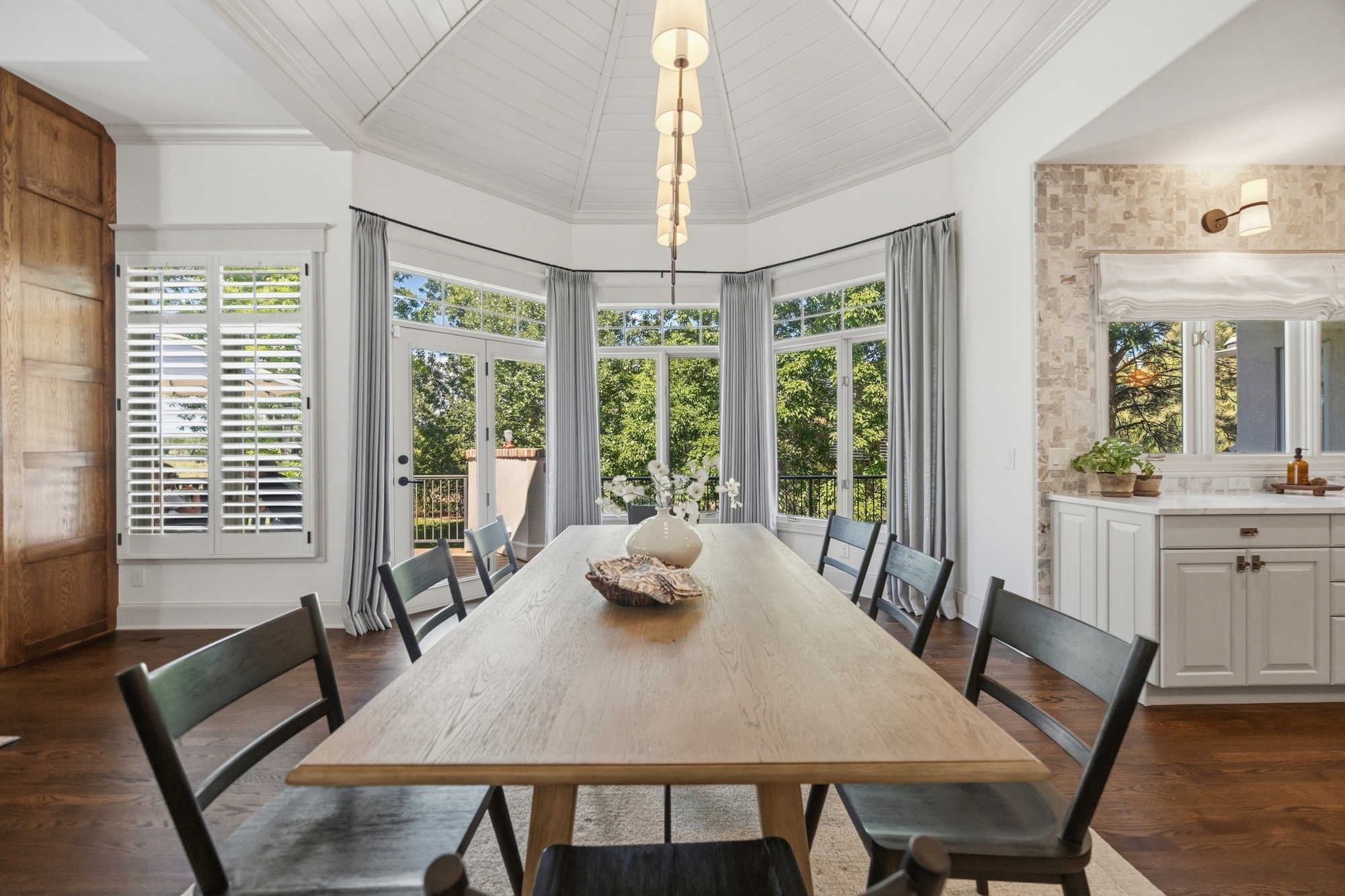 dining area with vaulted shiplap ceiling and large windows in greenwood village co whole home remodel