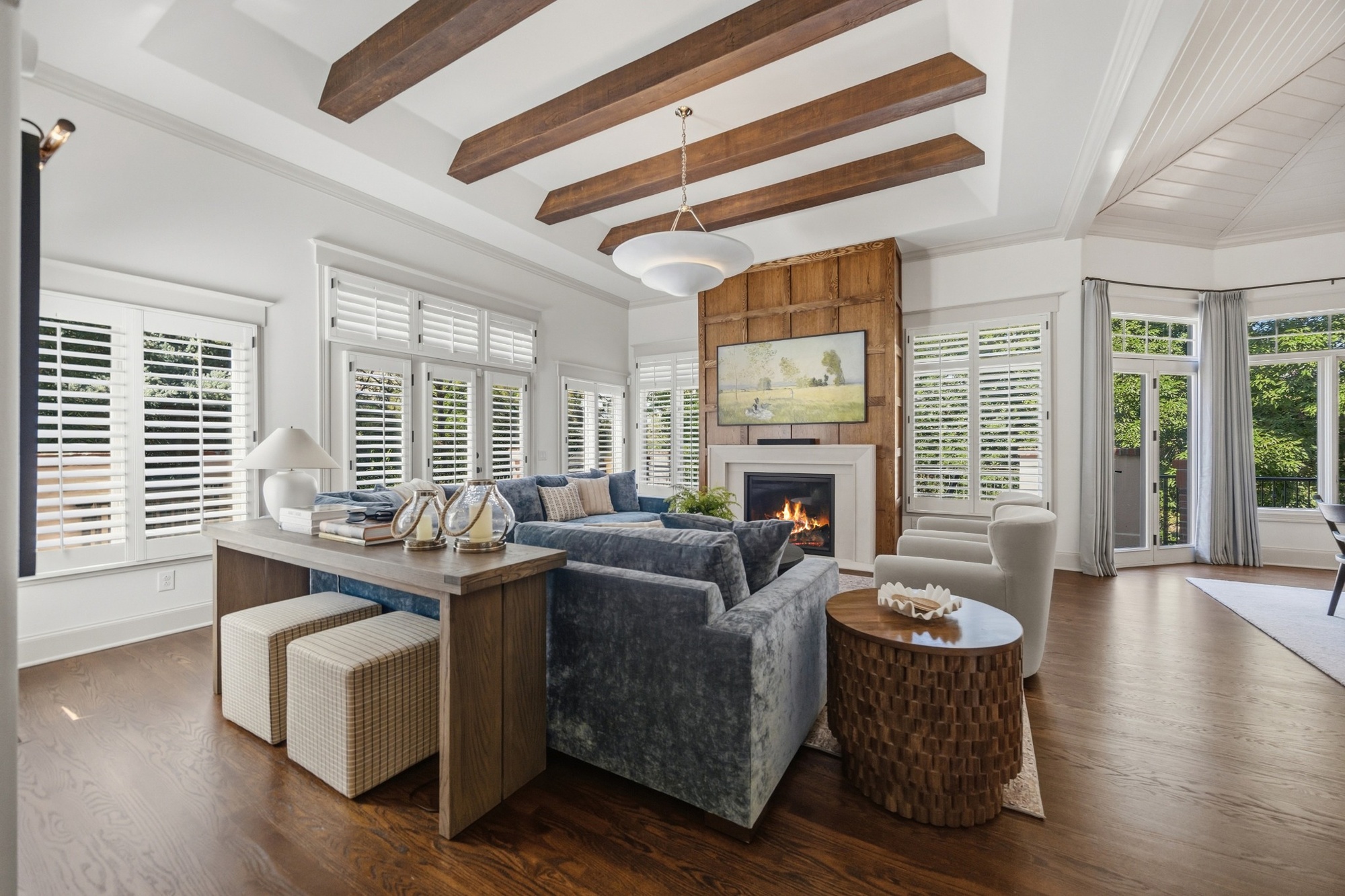 living room with exposed wood beams fireplace and blue sectional in greenwood village co whole home remodel living room with exposed wood beams fireplace and blue sectional in greenwood village co whole home remodel