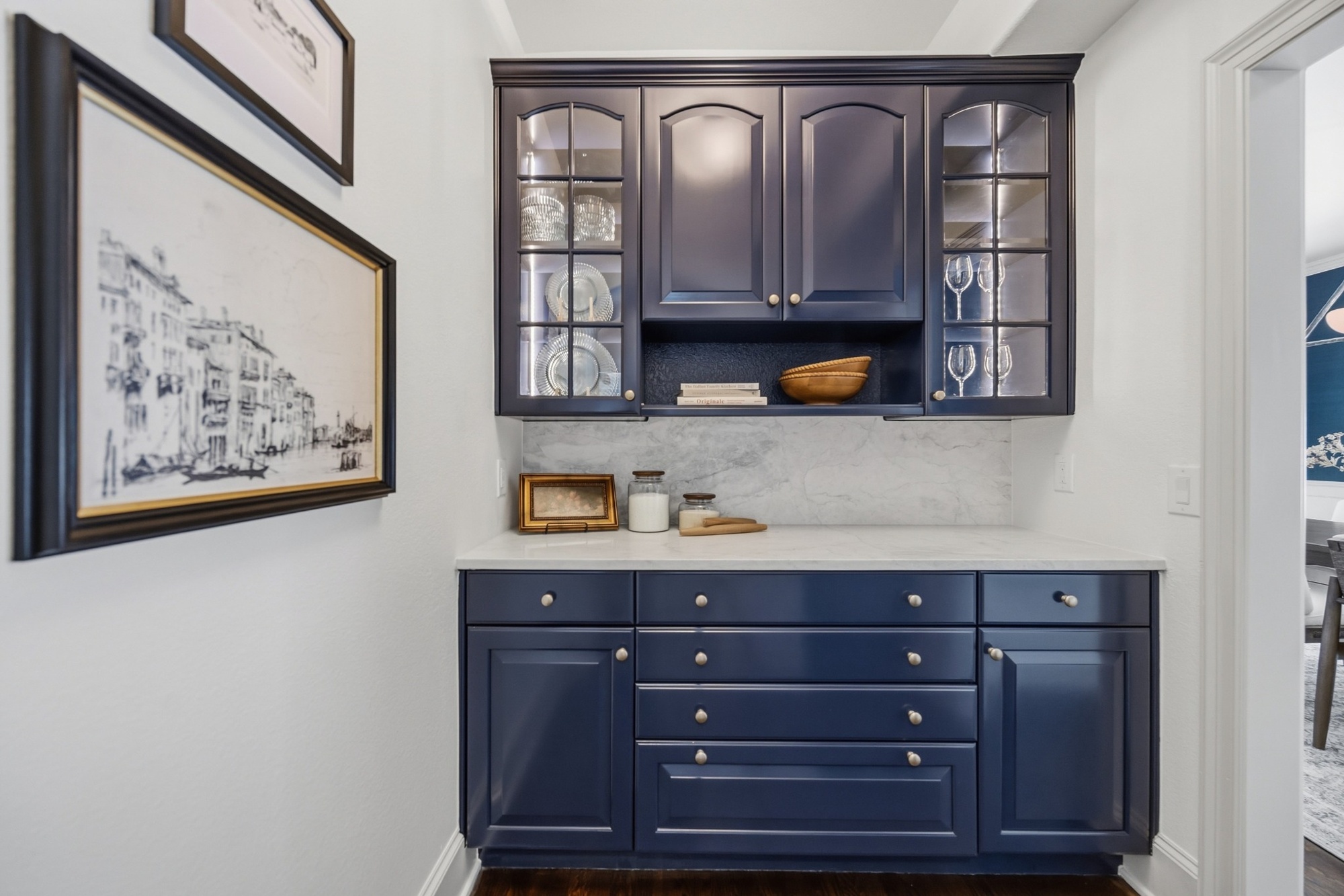 navy built in beverage cabinet with glass doors and stone backsplash in greenwood village co whole home remodel