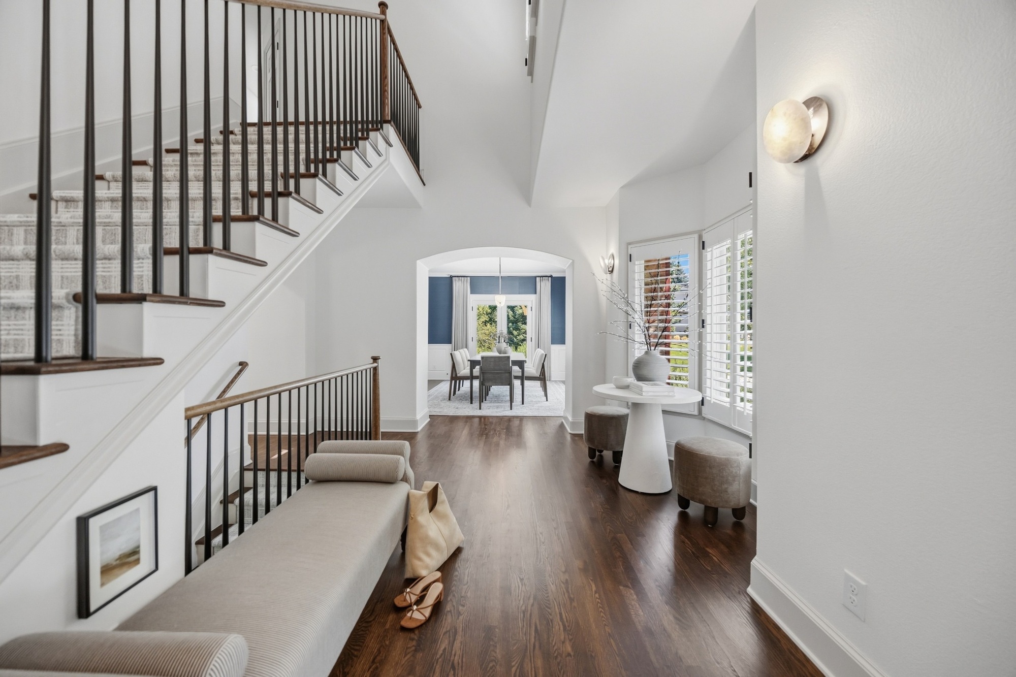 open hallway with staircase hardwood floors and dining room view in greenwood village co whole home remodel