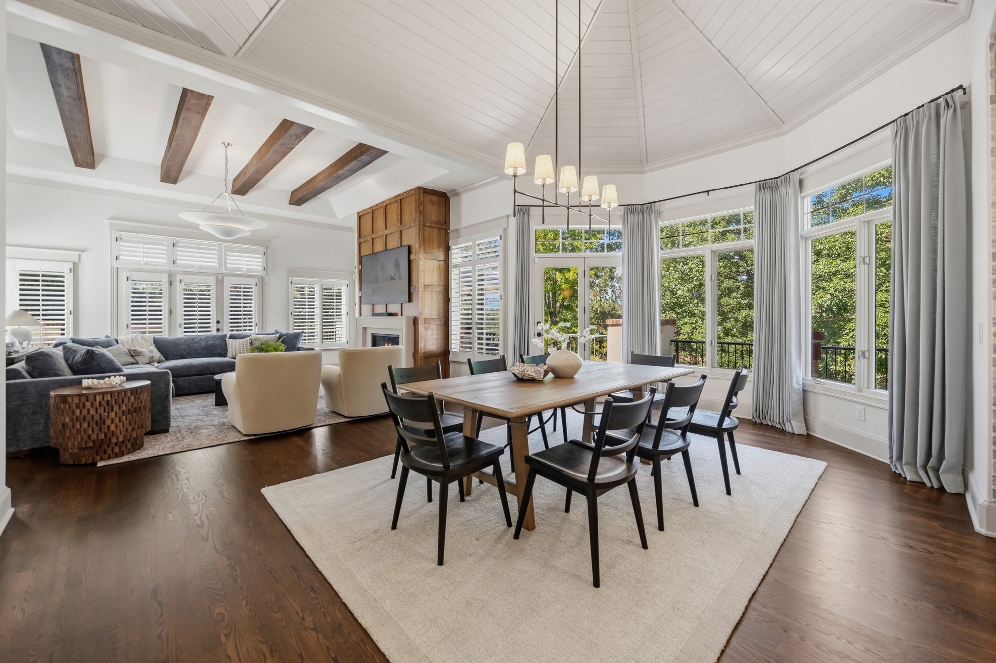open living and dining area with vaulted ceiling and fireplace in greenwood village co whole home remodel