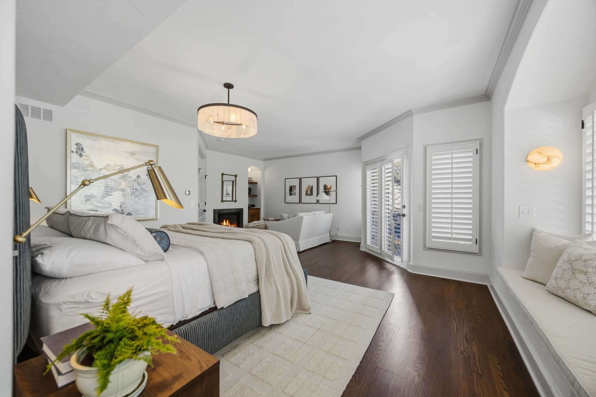 primary bedroom with fireplace sitting area and hardwood floors in greenwood village co whole home remodel