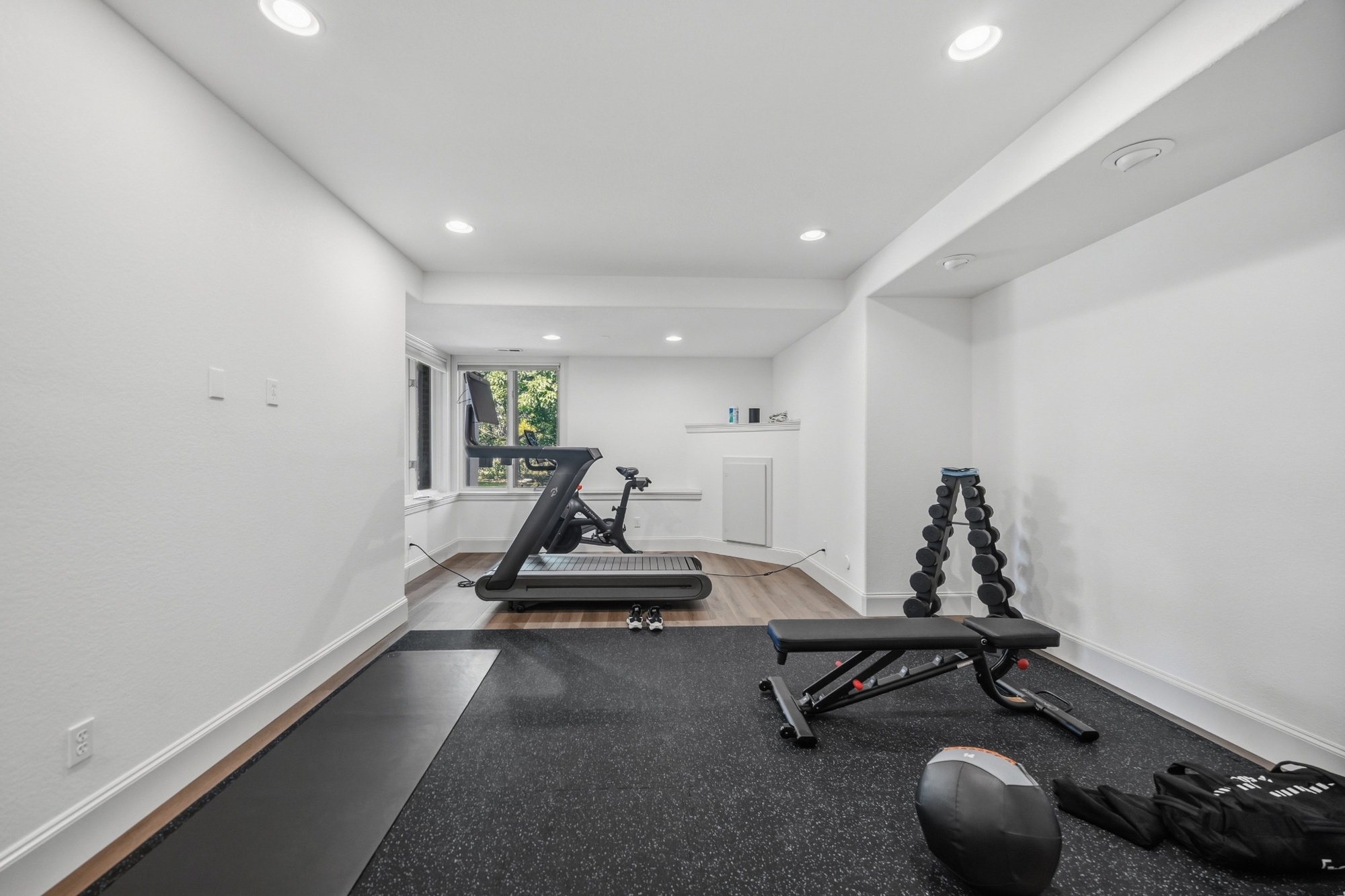 whole home remodel basement home gym with treadmill weights and workout bench in greenwood village co