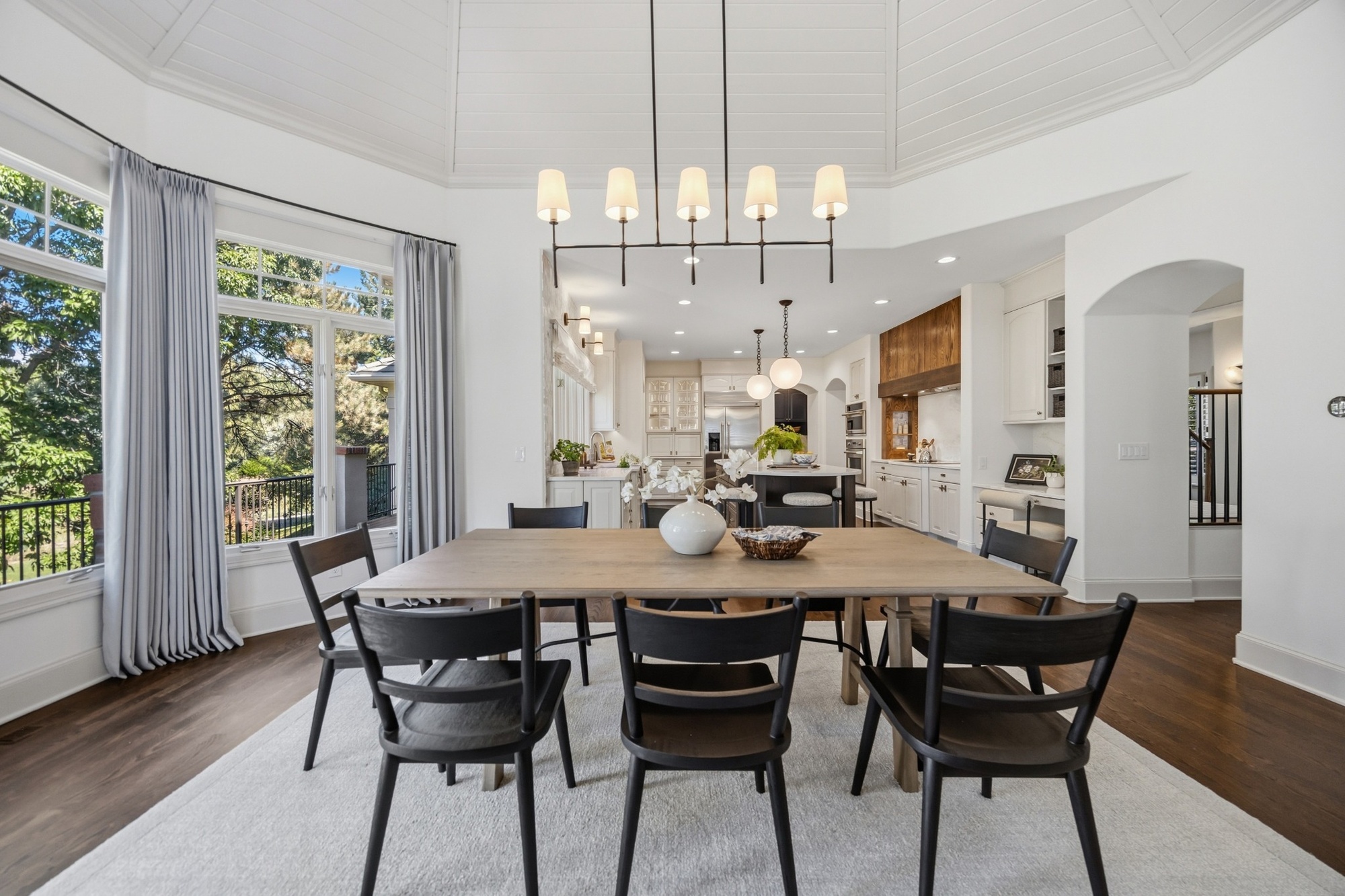 whole home remodel breakfast dining area with vaulted ceiling and open kitchen view in greenwood village co