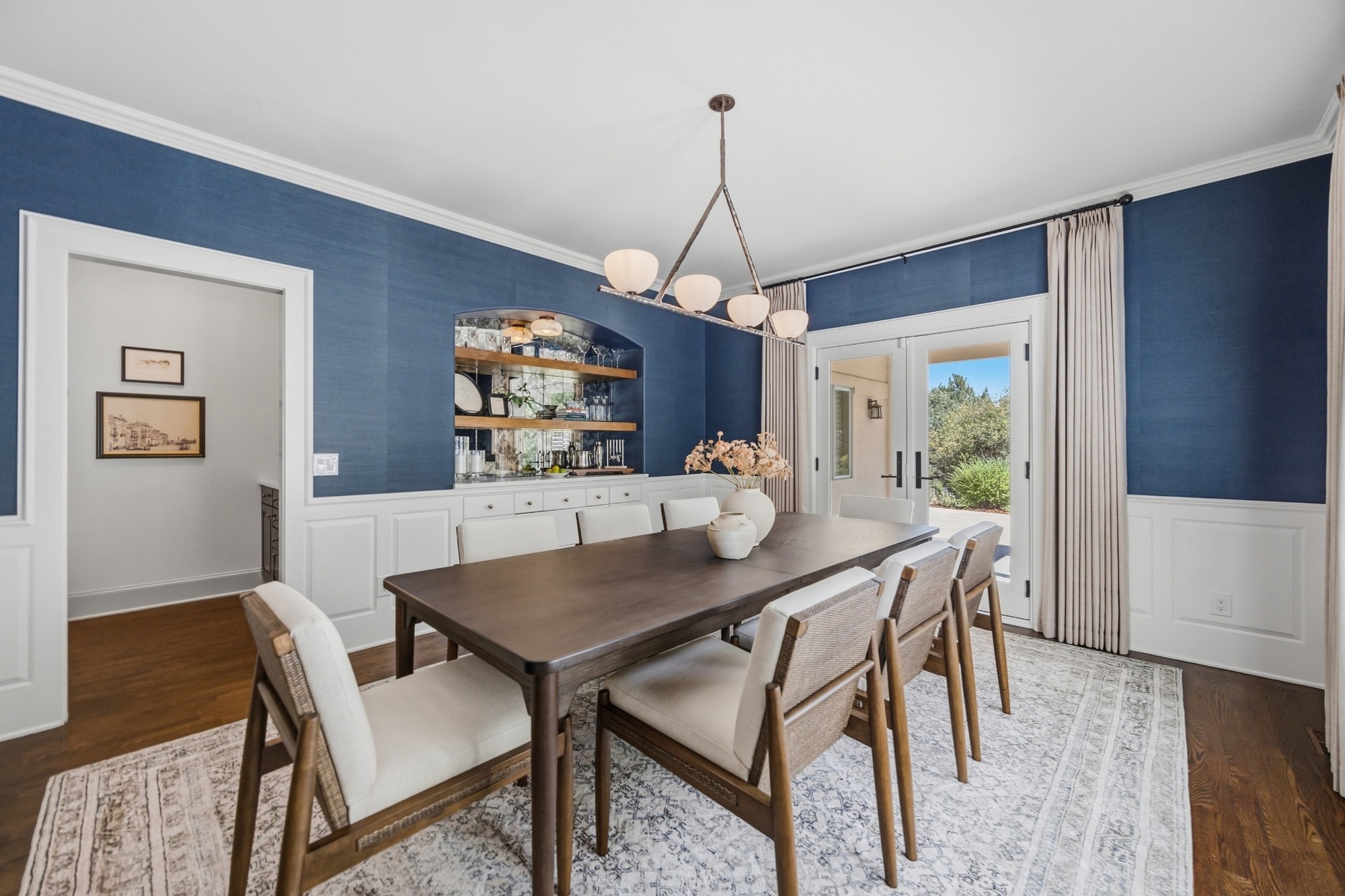 whole home remodel dining room with blue walls built in bar and french doors in greenwood village co