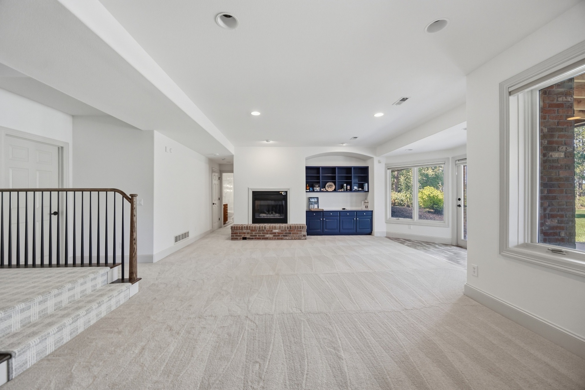 whole home remodel finished basement with fireplace built in cabinets and large windows in greenwood village co