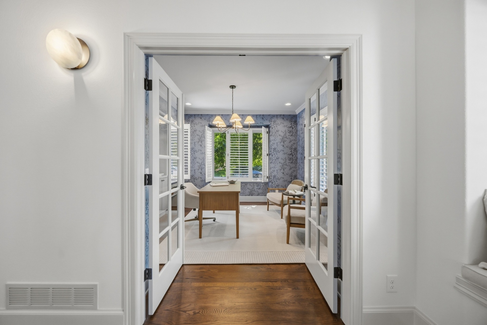 whole home remodel home office with french doors blue wallpaper and wood desk in greenwood village co
