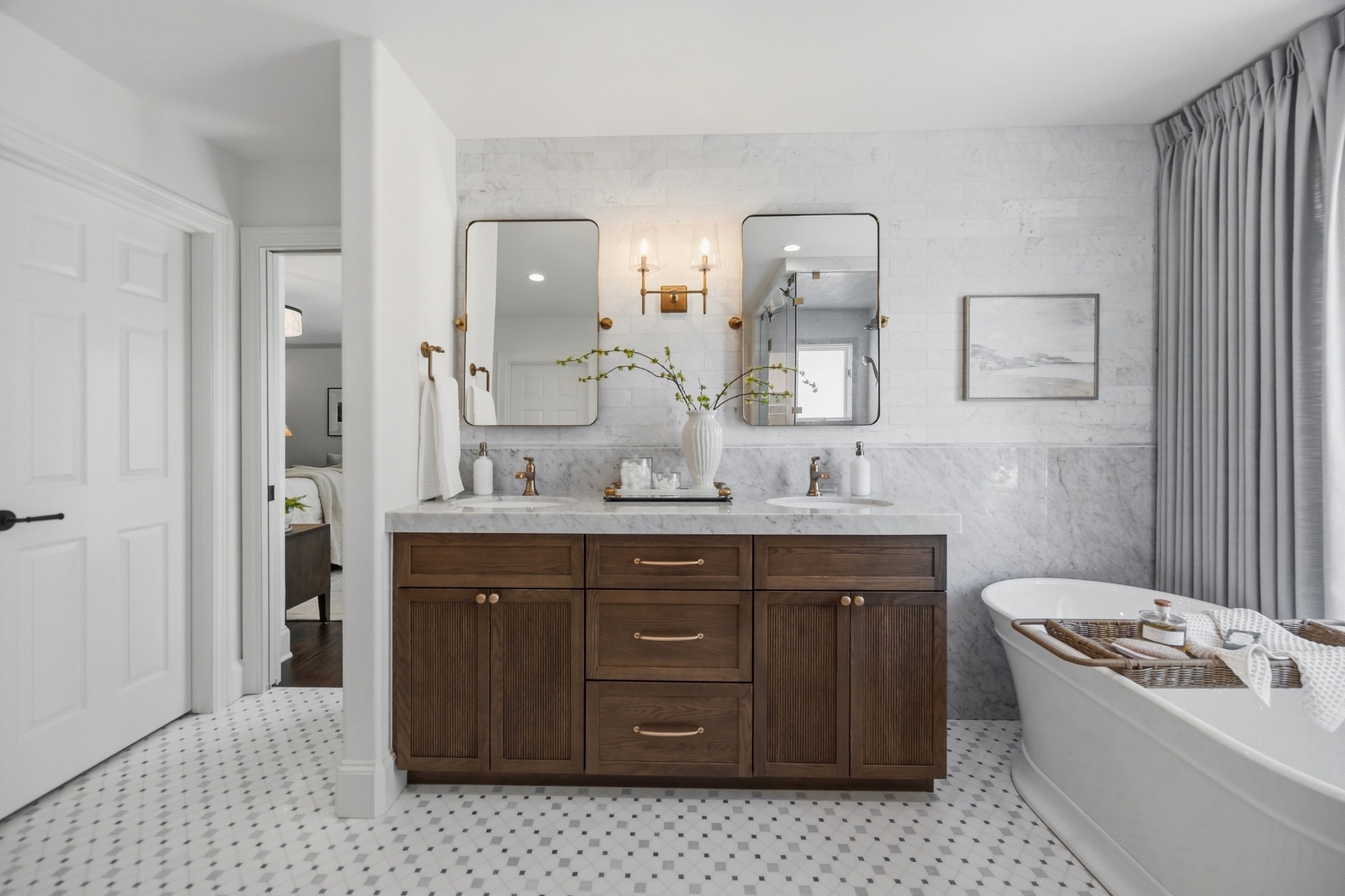 whole home remodel primary bathroom double vanity with marble walls and freestanding tub in greenwood village co