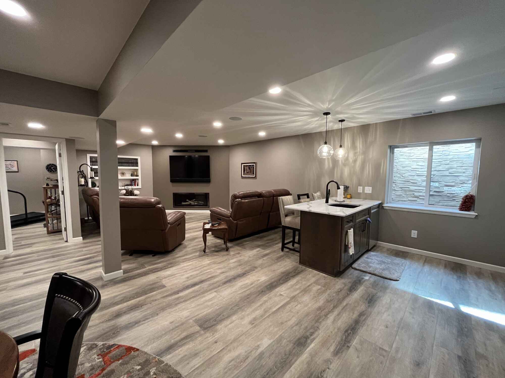 Beautiful-open-basement-kitchen-brown-cabinets-quartz-countertops-Littleton-Colorado8-1