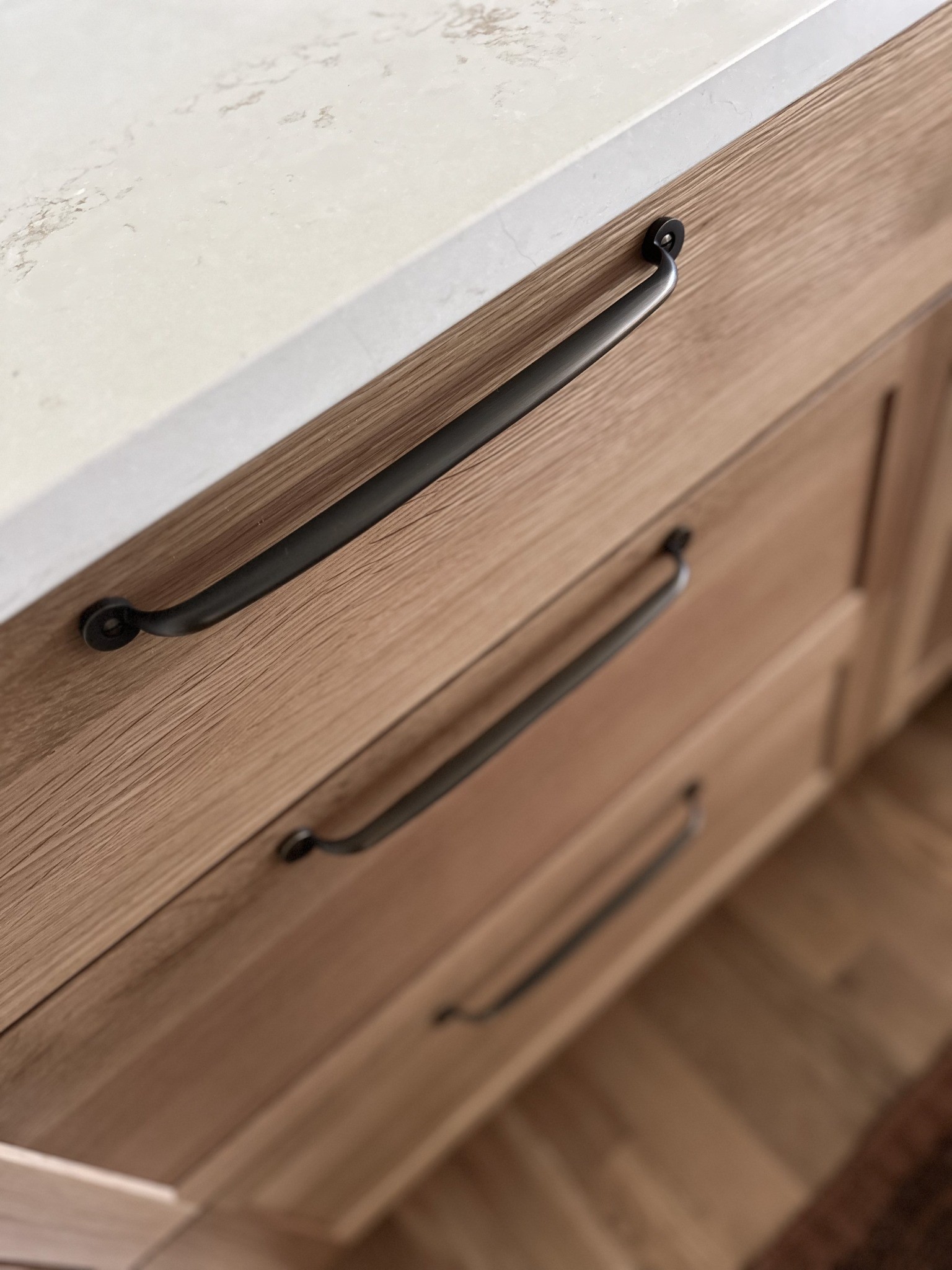 after-littleton-kitchen-remodel-black-cabinet-pulls-on-wood-drawers