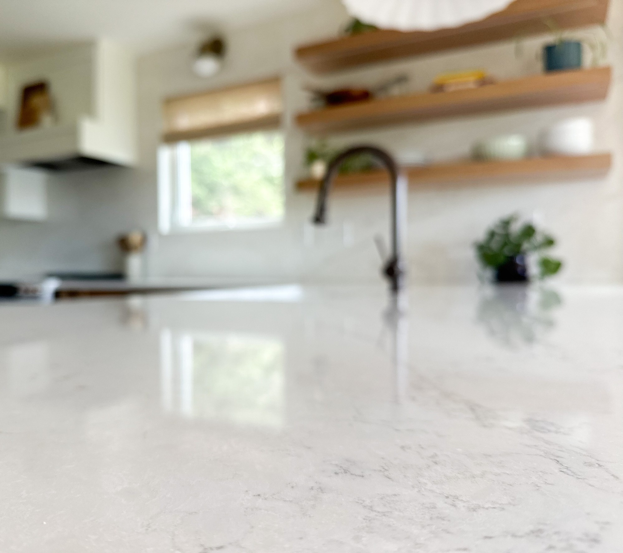 after-littleton-kitchen-remodel-polished-quartz-countertop-soft-focus-view