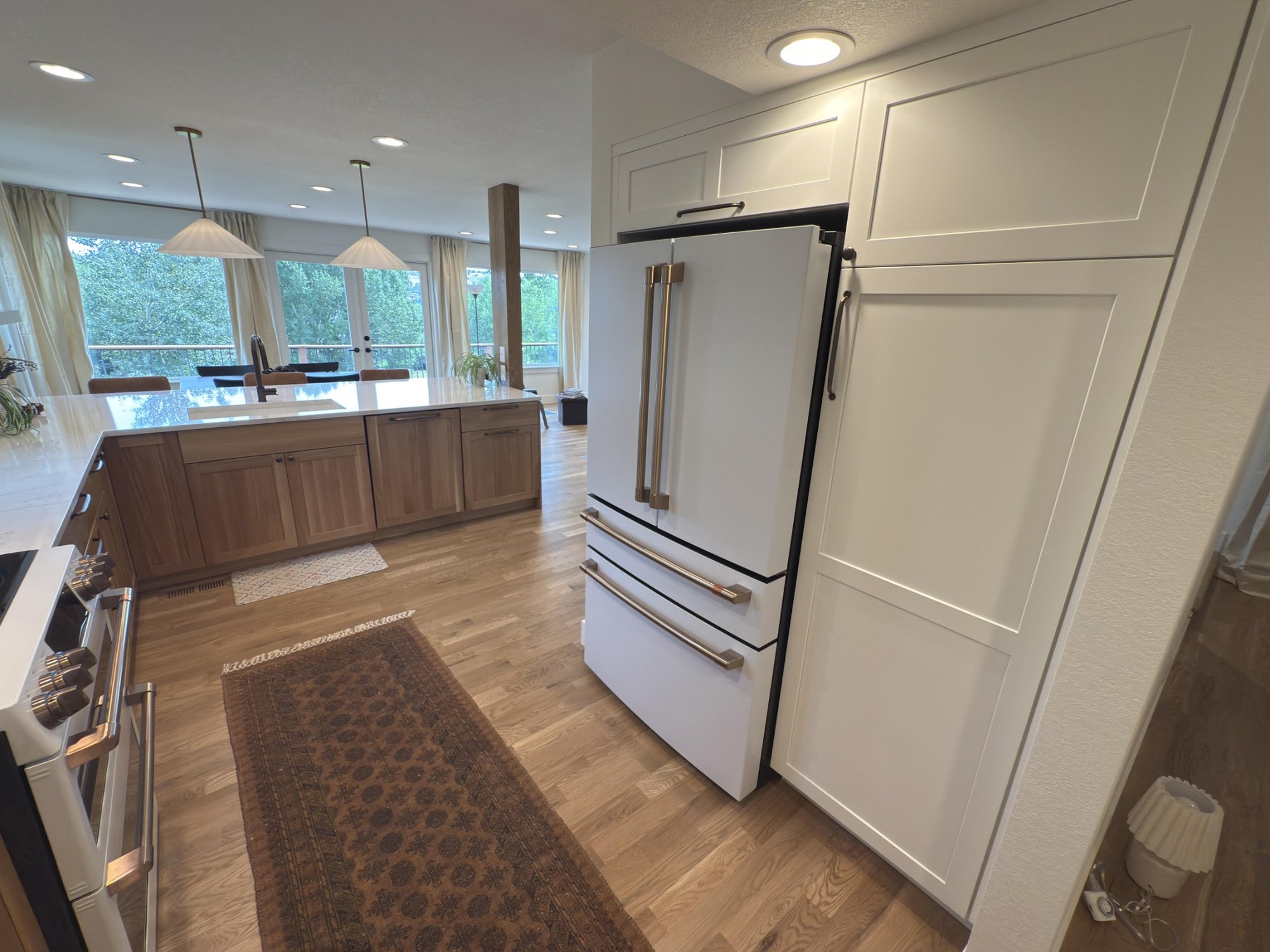 after-littleton-kitchen-remodel-refrigerator-wall-and-peninsula-wide-view
