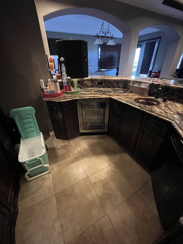 before castle pines whole home remodel basement wet bar with granite countertops