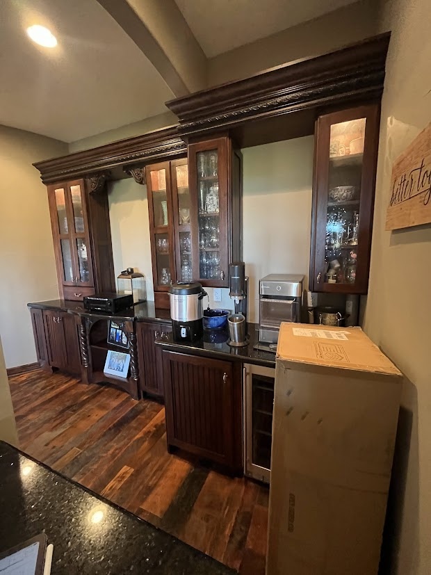 before castle pines whole home remodel built in beverage station with dark wood cabinetry