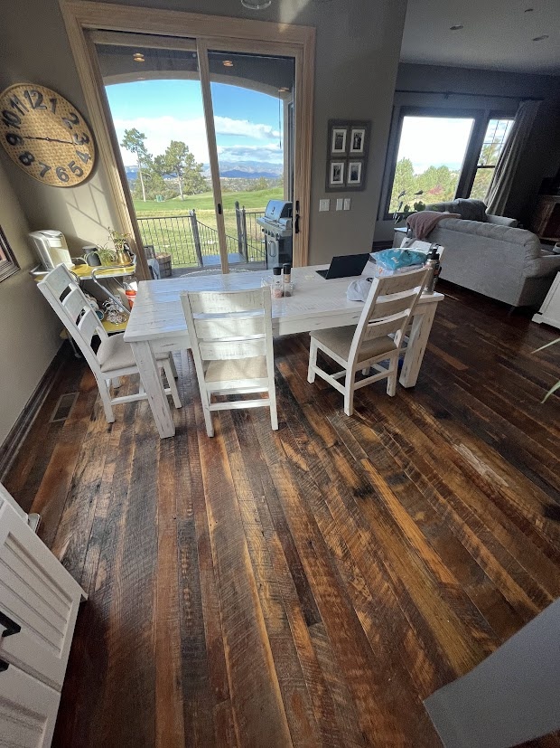 before castle pines whole home remodel dining area with sliding glass door and mountain views