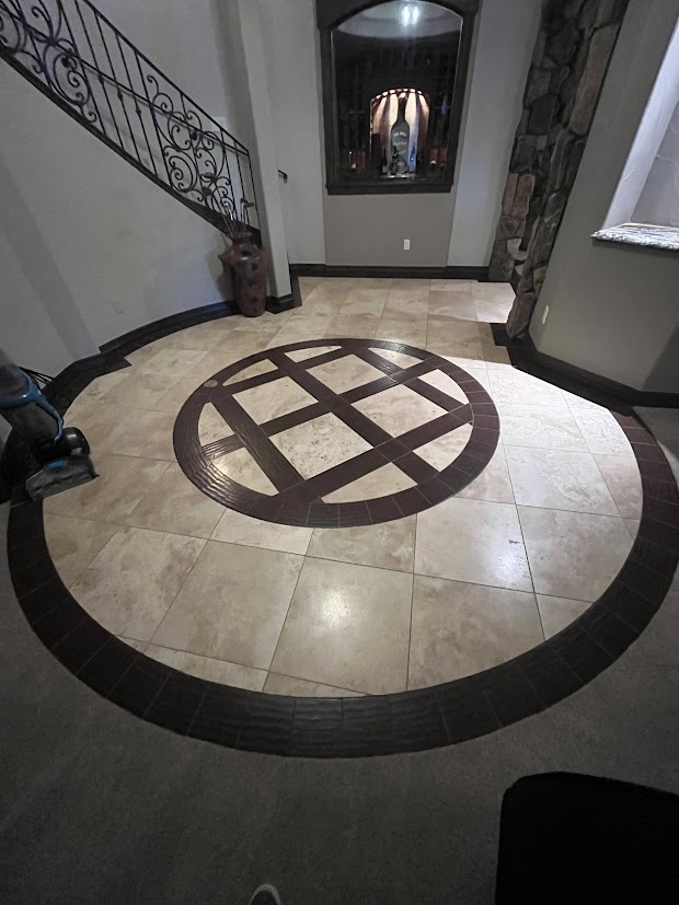 before castle pines whole home remodel foyer tile flooring with circular wood inlay