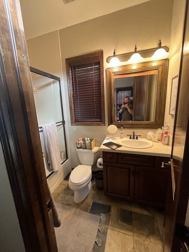 before castle pines whole home remodel traditional bathroom with wood vanity and shower tub combo
