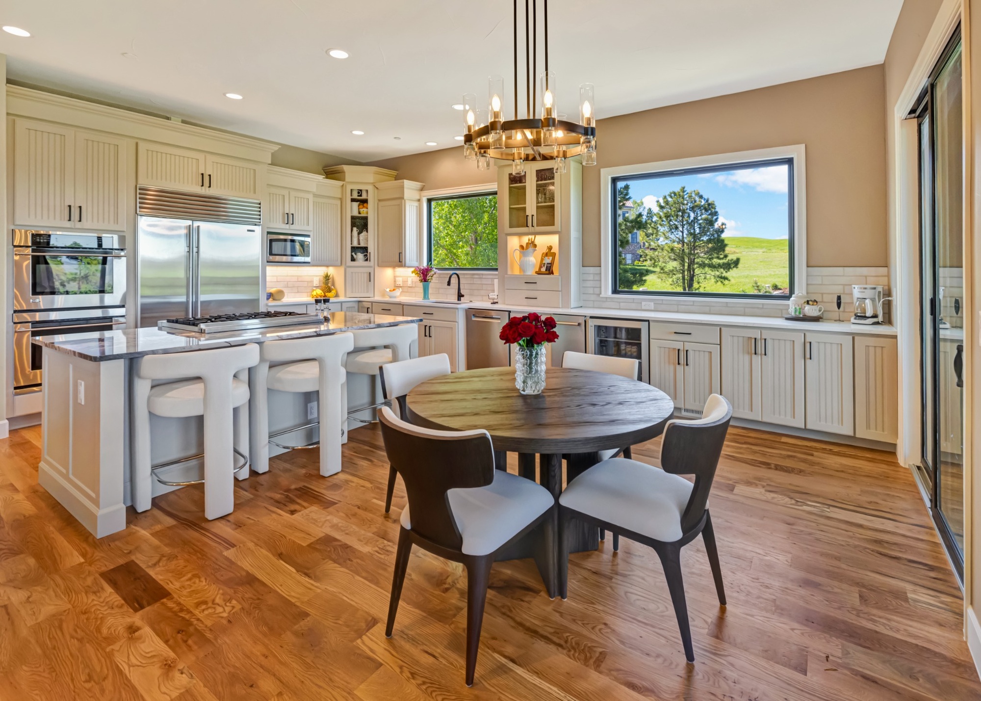 castle pines whole home remodel contemporary kitchen with wood flooring and panoramic windows