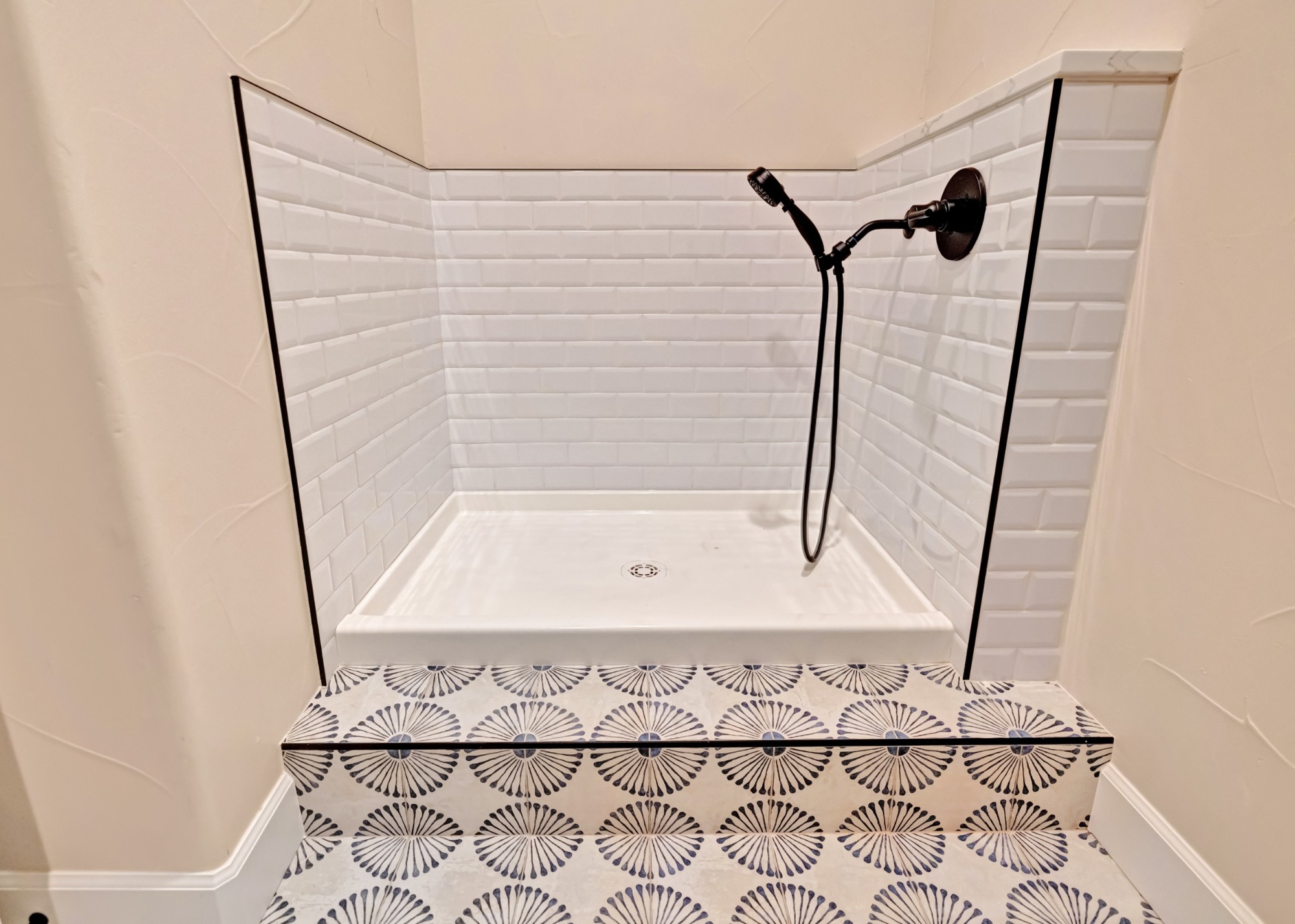 castle pines whole home remodel dog wash with white subway tile and patterned floor tile