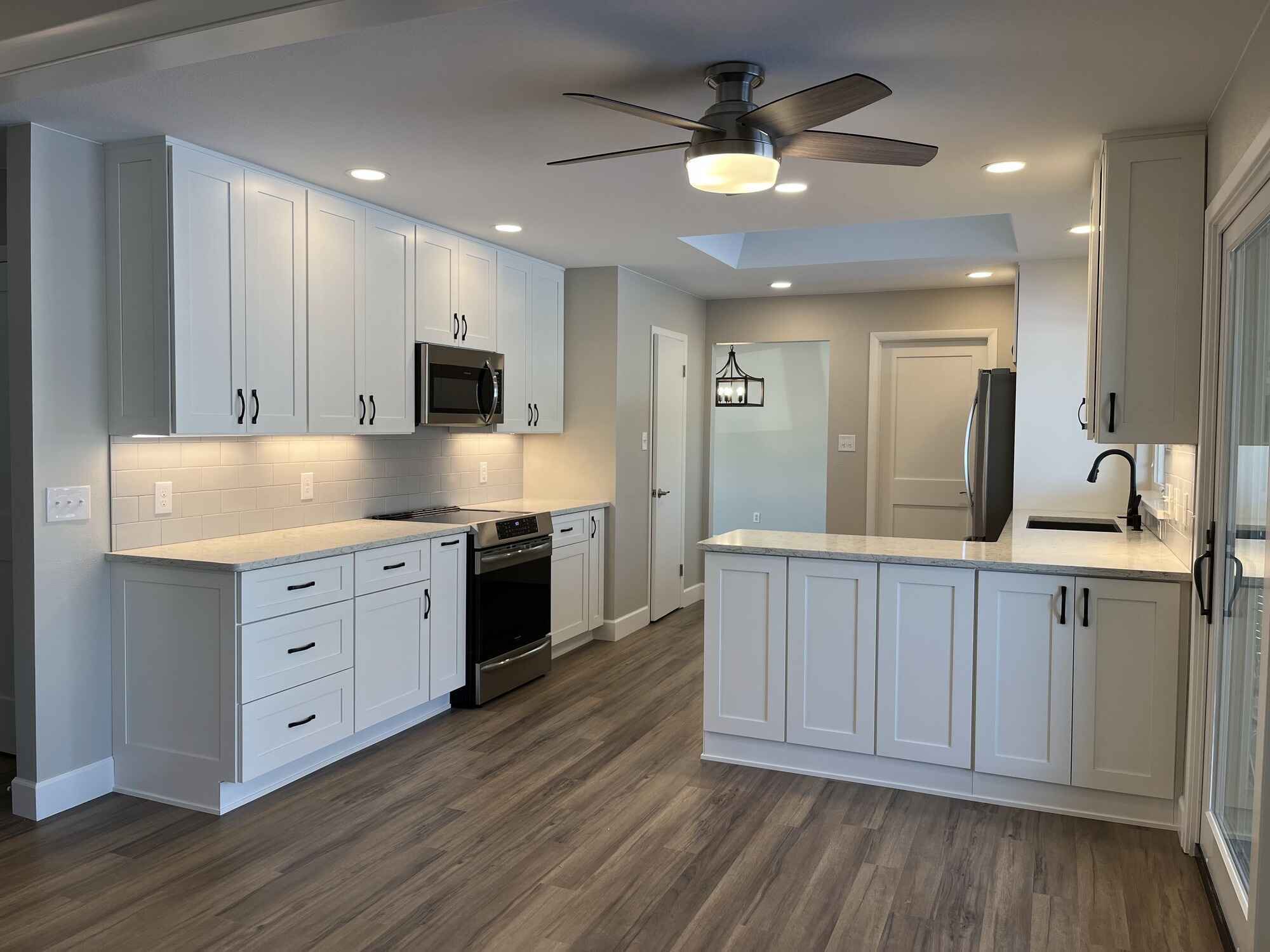 Custom-bright-kitchen-white-cabinets-vinyl-floors-Littleton-Colorado by Grimes Home Concepts