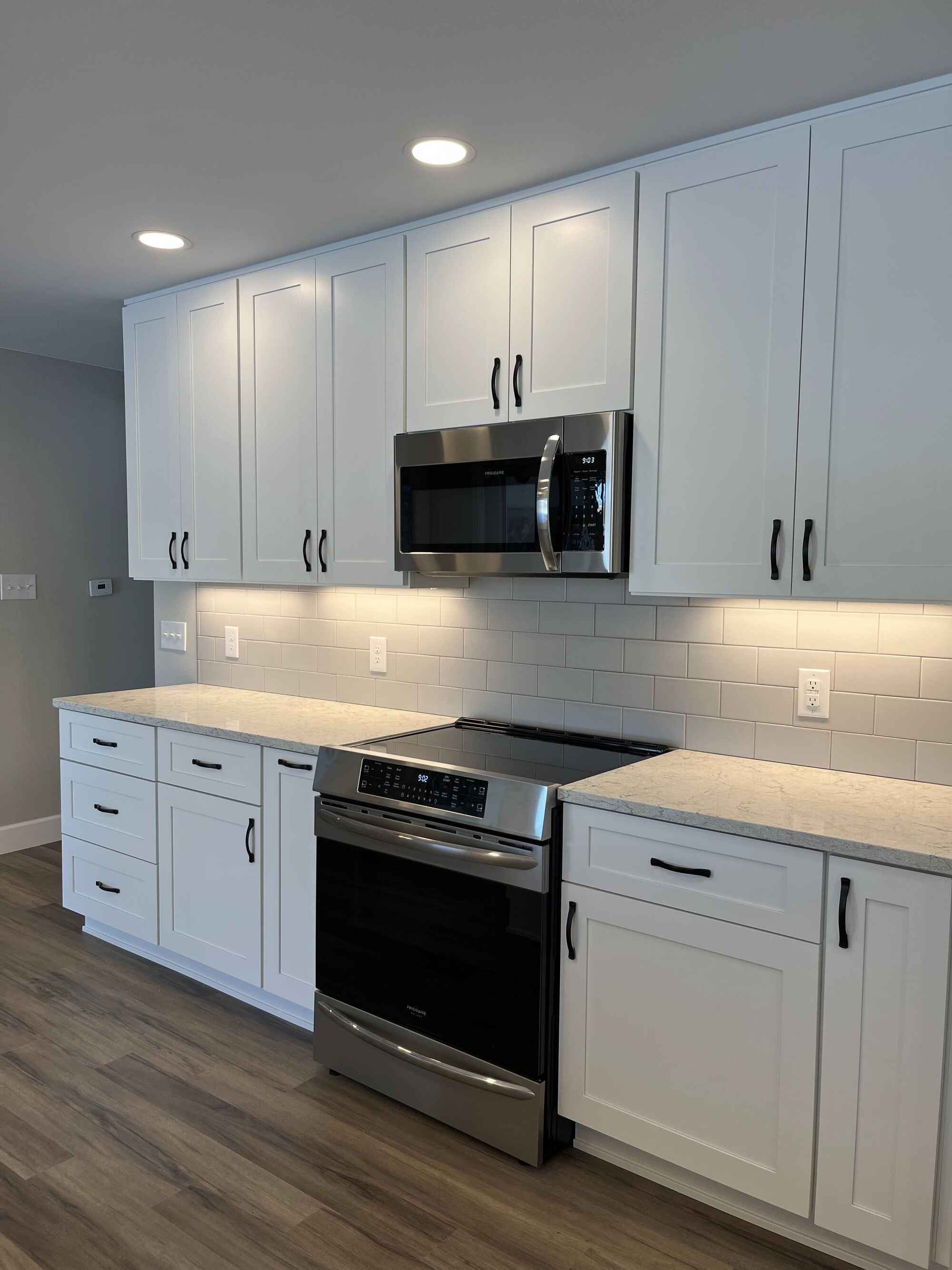 Custom-bright-kitchen-white-cabinets-vinyl-floors-Littleton-Colorado by Grimes Home Concepts