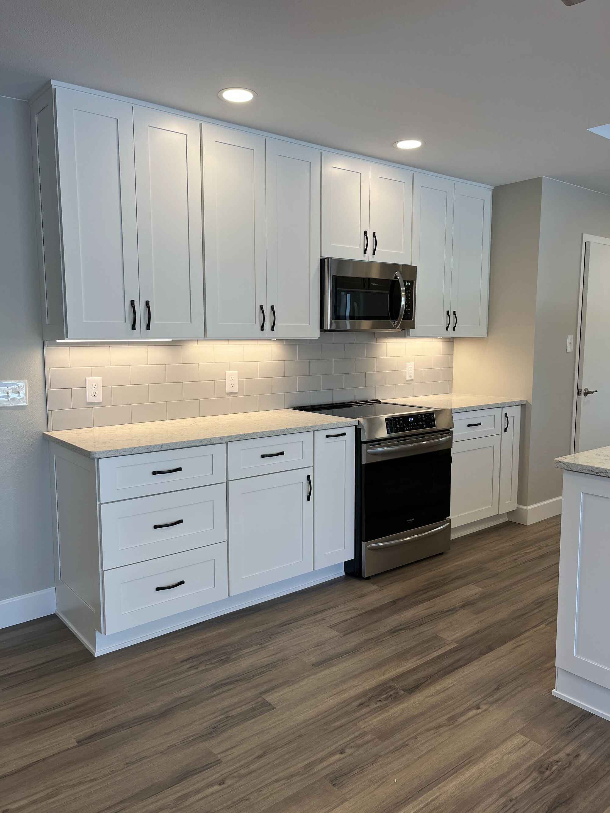Custom-bright-kitchen-white-cabinets-vinyl-floors-Littleton-Colorado by Grimes Home Concepts